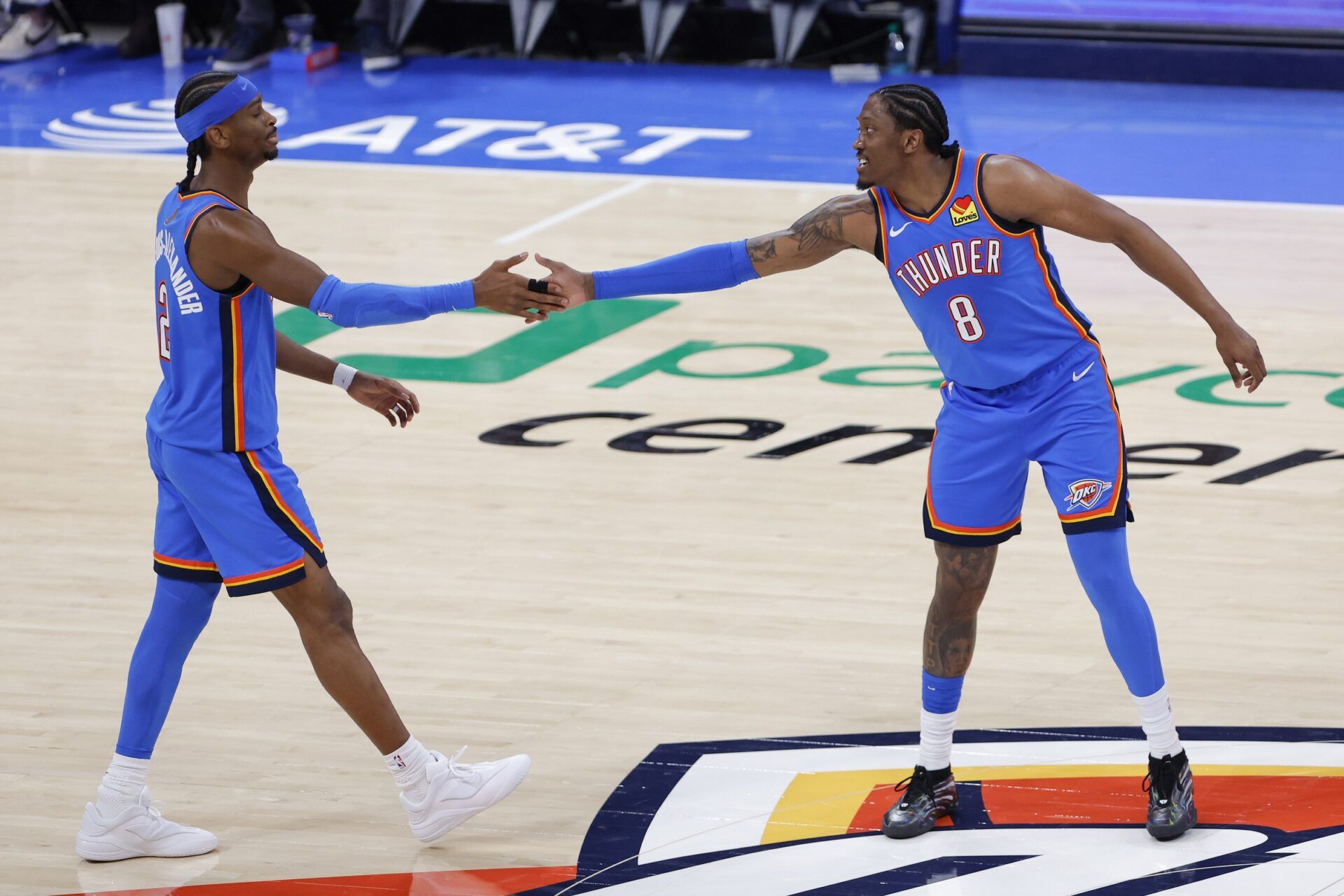 Oklahoma City Thunder guard/forward Jalen Williams (8) celebrates with Oklahoma City Thunder guard Shai Gilgeous-Alexander (2) after he scored against the San Antonio Spurs during the second half at Paycom Center.