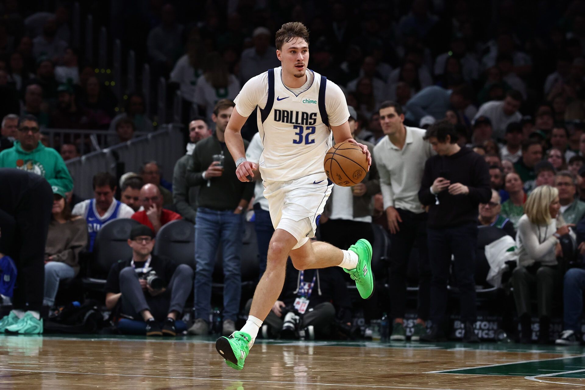 Dallas Mavericks forward Cooper Flagg (32) brings the ball up the court against the Boston Celtics during the second half at TD Garden.