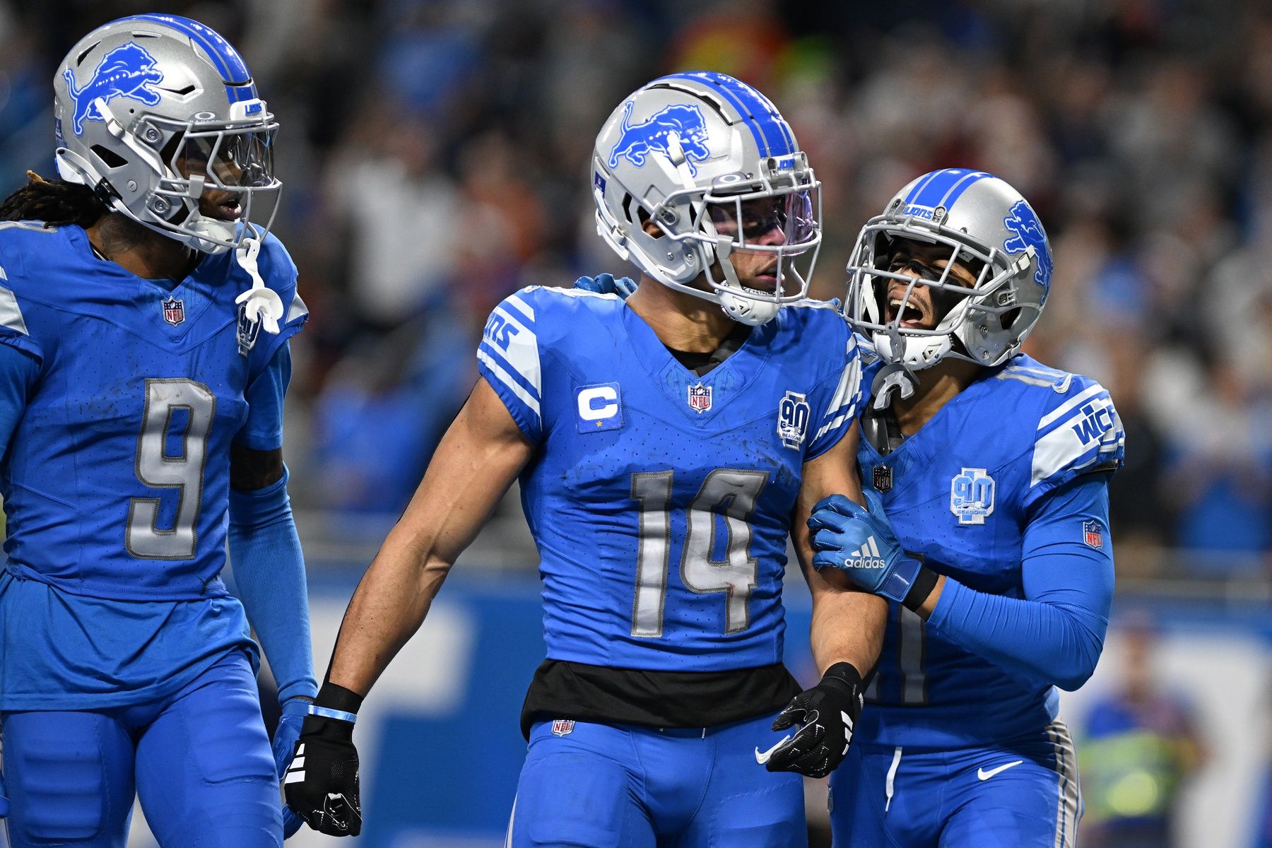 Detroit Lions wide receiver Amon-Ra St. Brown (14) celebrates in the end zone with wide receiver Kalif Raymond (11) and wide receiver Jameson Williams (9) after scoring a touchdown against the Denver Broncos in the second quarter at Ford Field.