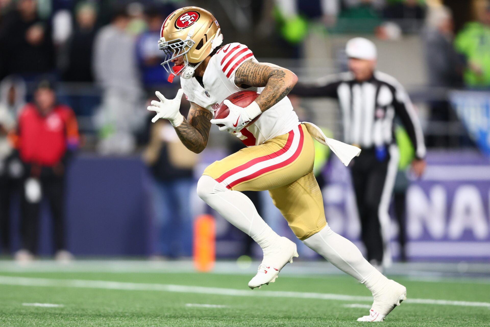 San Francisco 49ers wide receiver Skyy Moore (9) returns a kickoff against the Seattle Seahawks during the second half in an NFC Divisional Round game at Lumen Field.