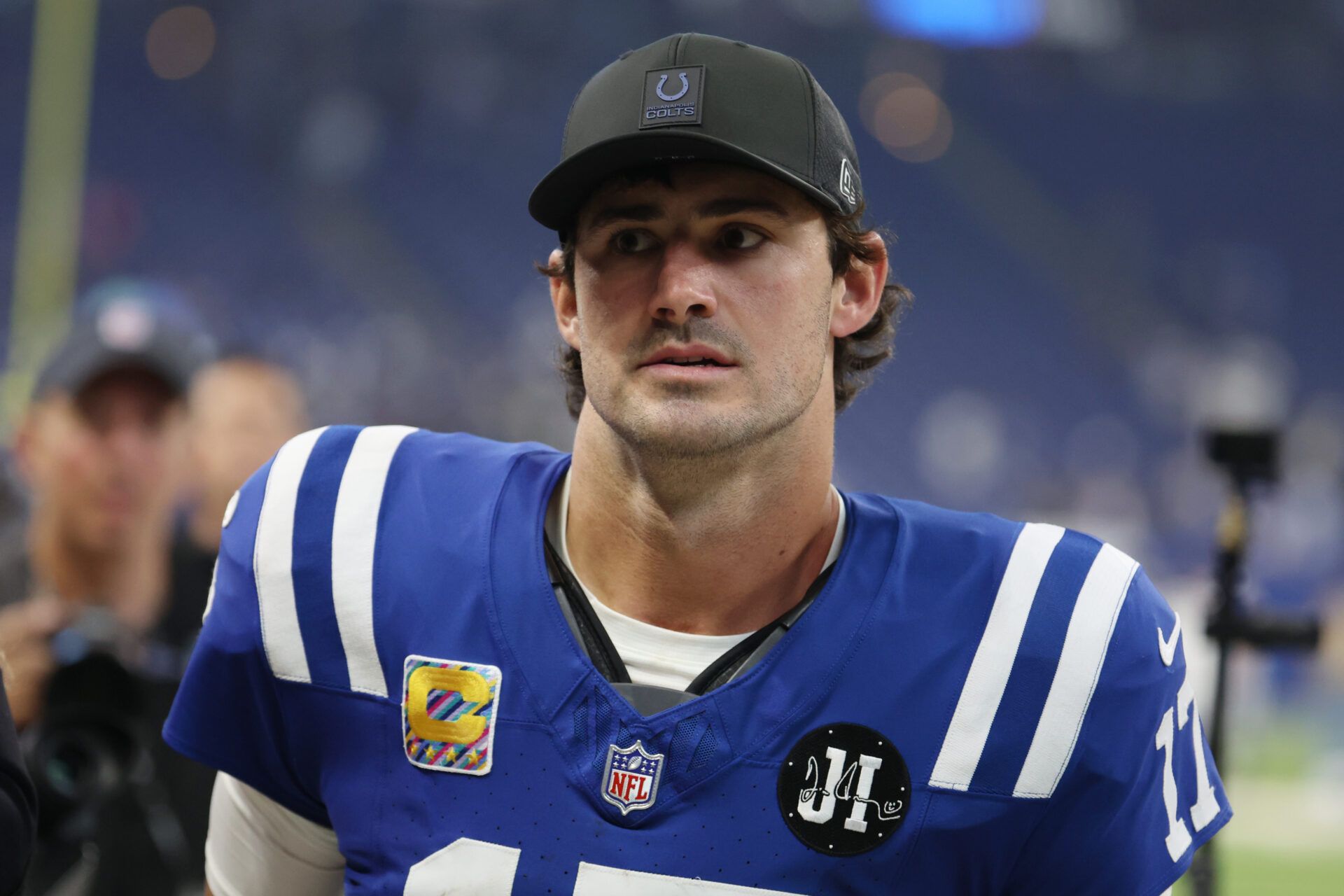 Indianapolis Colts quarterback Daniel Jones (17) walks off the field after their win against the Las Vegas Raiders at Lucas Oil Stadium.