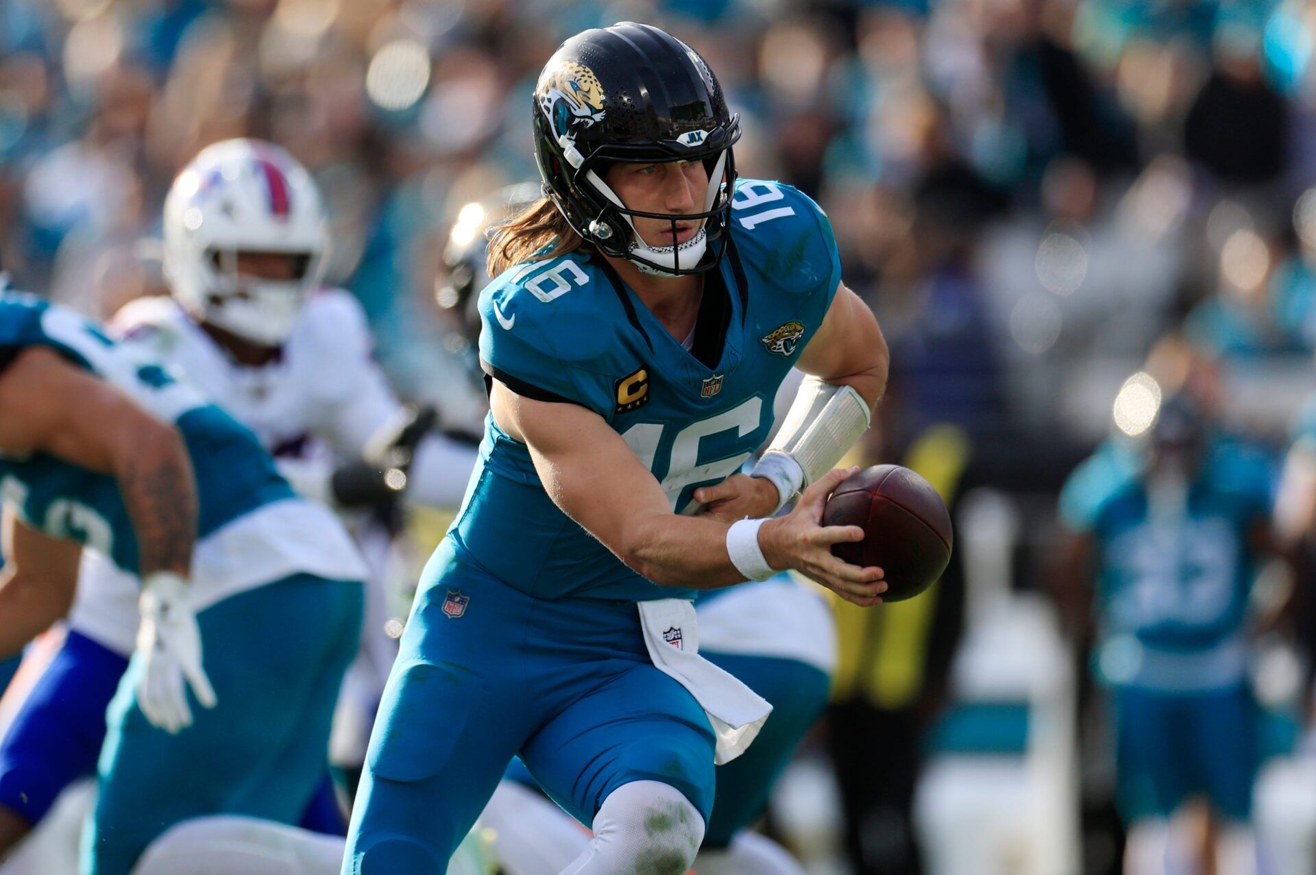 Jacksonville Jaguars quarterback Trevor Lawrence (16) looks to handoff during the fourth quarter of an NFL football AFC Wild Card playoff matchup, Sunday, Jan. 11, 2026, in Jacksonville, Fla. The Bills defeated the Jaguars 27-24. [Corey Perrine/Florida Times-Union]
