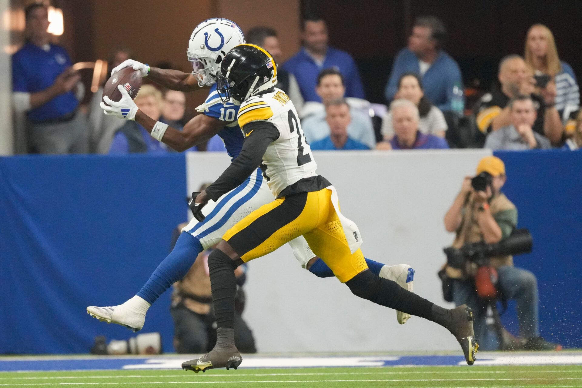 Indianapolis Colts wide receiver Michael Pittman Jr. (11) makes a catch in front of Pittsburgh Steelers cornerback Joey Porter Jr. (24) on Sunday, Sept. 29, 2024, during a game against the Pittsburgh Steelers at Lucas Oil Stadium in Indianapolis.