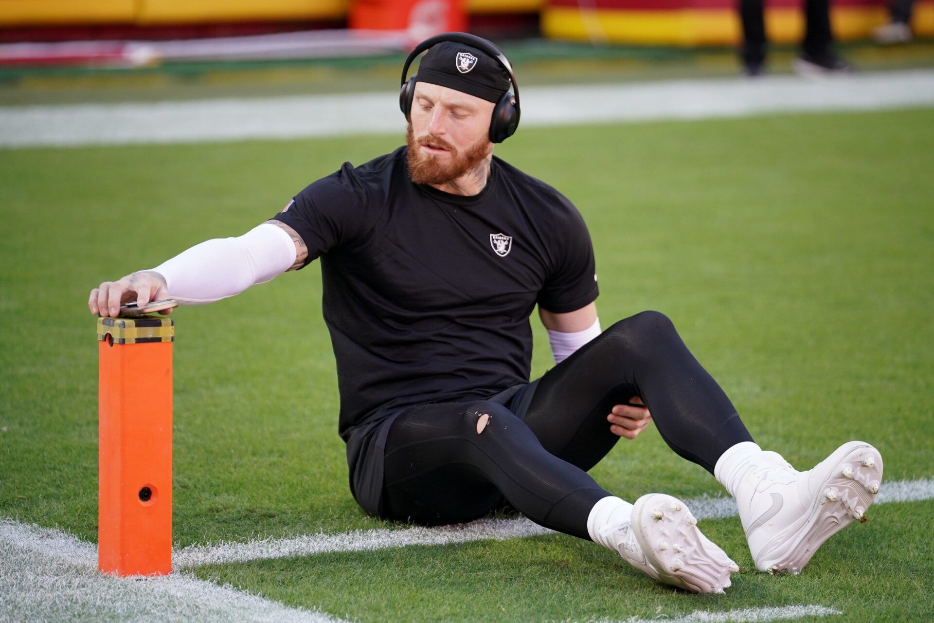 Las Vegas Raiders defensive end Maxx Crosby (98) stretches during warmups prior to the game against the Kansas City Chiefs at GEHA Field at Arrowhead Stadium.