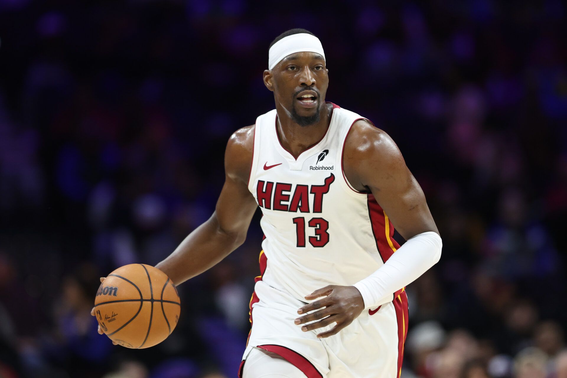 Miami Heat center Bam Adebayo (13) dribbles up court against the Philadelphia 76ers during the first quarter at Xfinity Mobile Arena.
