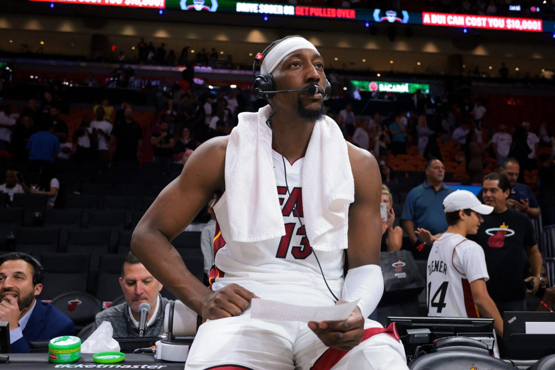 Miami Heat center Bam Adebayo (13) is interviewed after the game against the Charlotte Hornets at Kaseya Center.