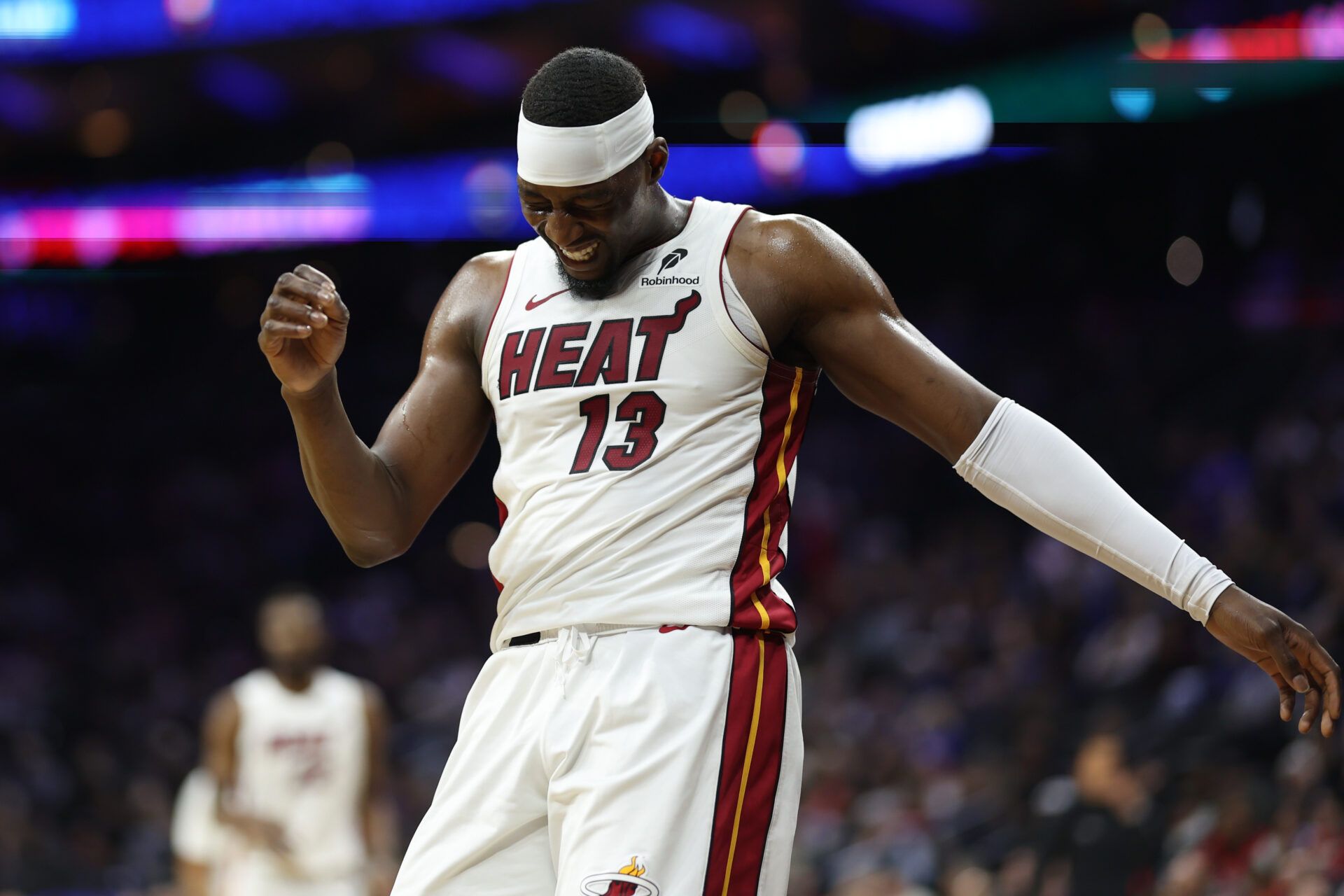 Miami Heat center Bam Adebayo (13) reacts after a collision during the first quarter against the Philadelphia 76ers at Xfinity Mobile Arena.