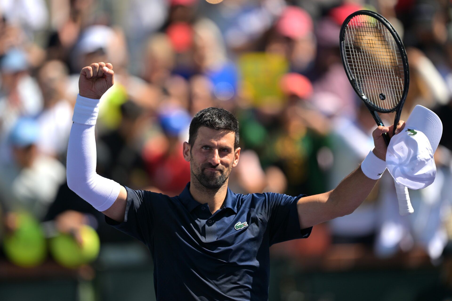 Novak Djokovic (SRB) celebrates after his third round match as he defeated Aleksandar Kovacevic (USA) during the BNP Paribas Open at the Indian Wells Tennis Garden.
