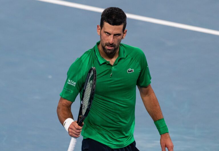 Novak Djokovic of Serbia in action against Jannik Sinner of Italy in the semifinals of the mens singles at the Australian Open at Rod Laver Arena in Melbourne Park.