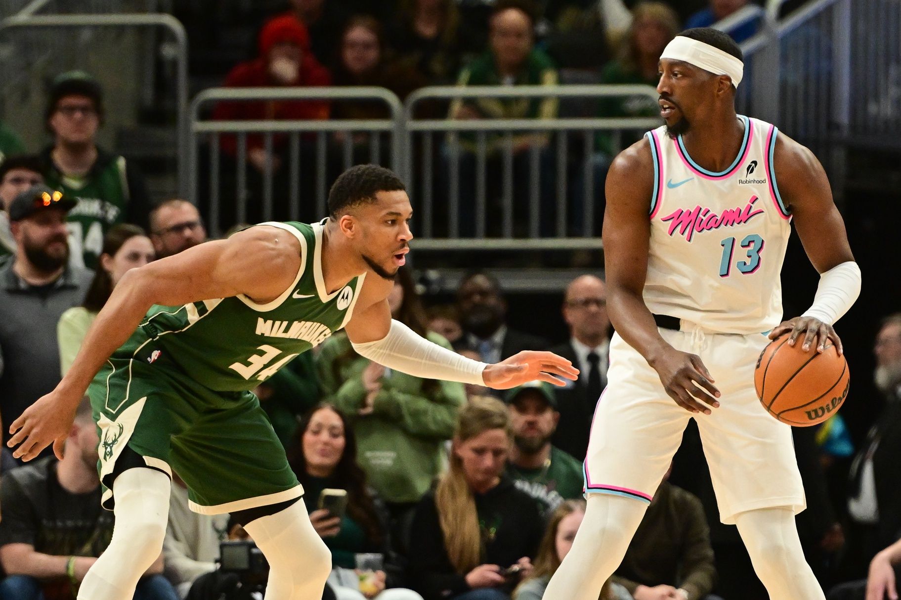 Miami Heat center Bam Adebayo (13) is guarded by Milwaukee Bucks forward Giannis Antetokounmpo (34) in the first quarter at Fiserv Forum.