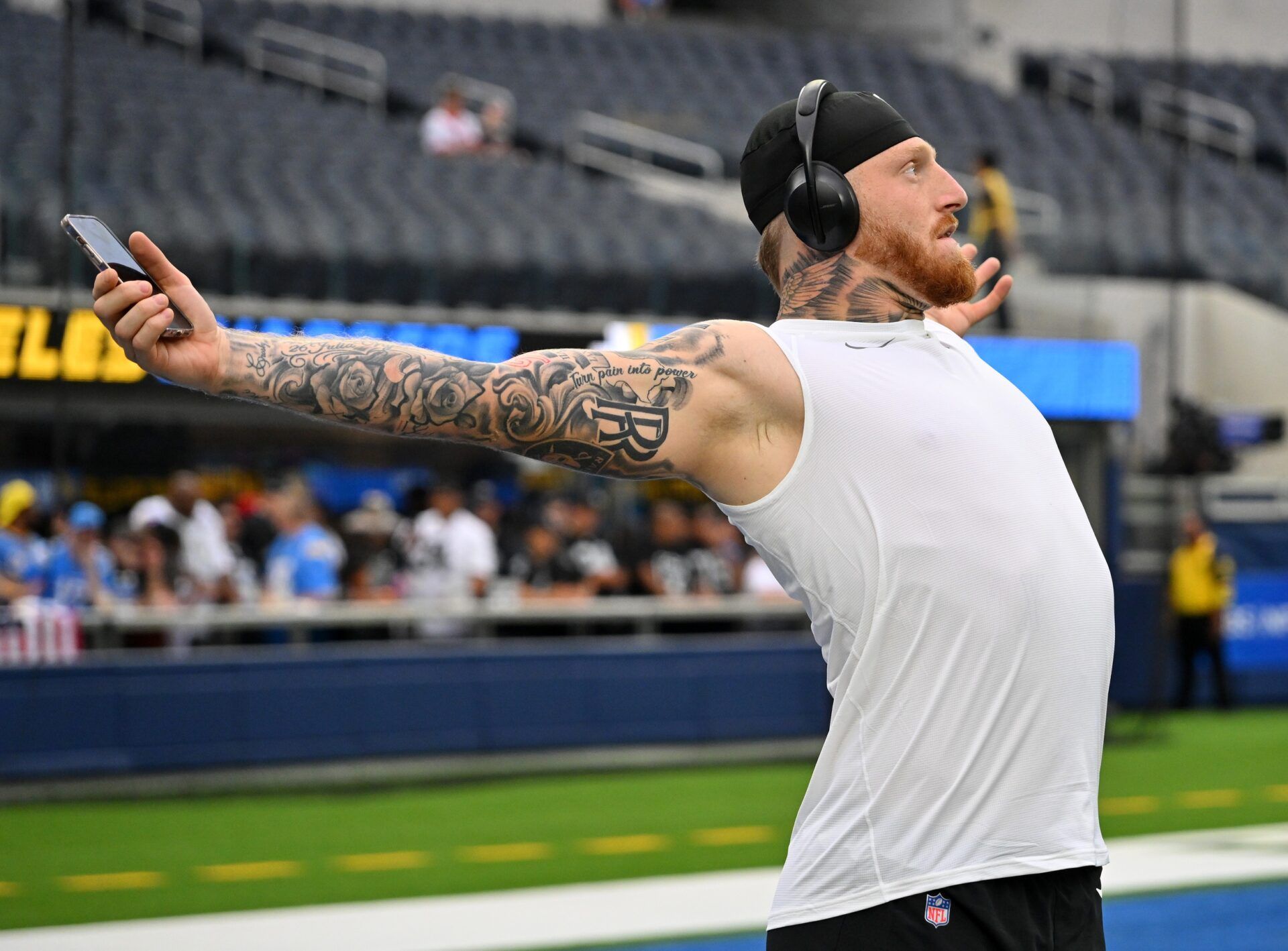 Las Vegas Raiders defensive end Maxx Crosby (98) warms up before the game against the Los Angeles Chargers at SoFi Stadium.