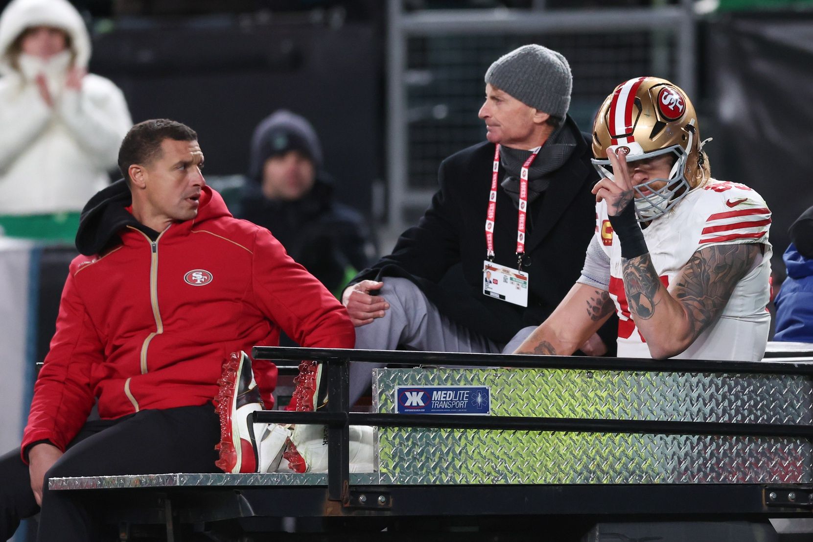 San Francisco 49ers tight end George Kittle (85) gestures as he is carted off the field after an injury during the second quarter against the Philadelphia Eagles in an NFC Wild Card Round game at Lincoln Financial Field.