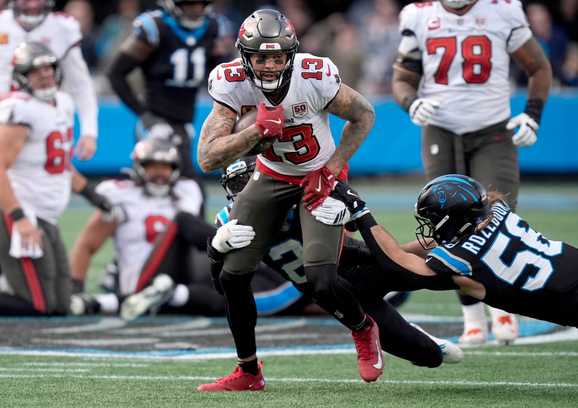 Tampa Bay Buccaneers wide receiver Mike Evans (13) runs against Carolina Panthers linebacker Christian Rozeboom (56) during the second half at Bank of America Stadium.