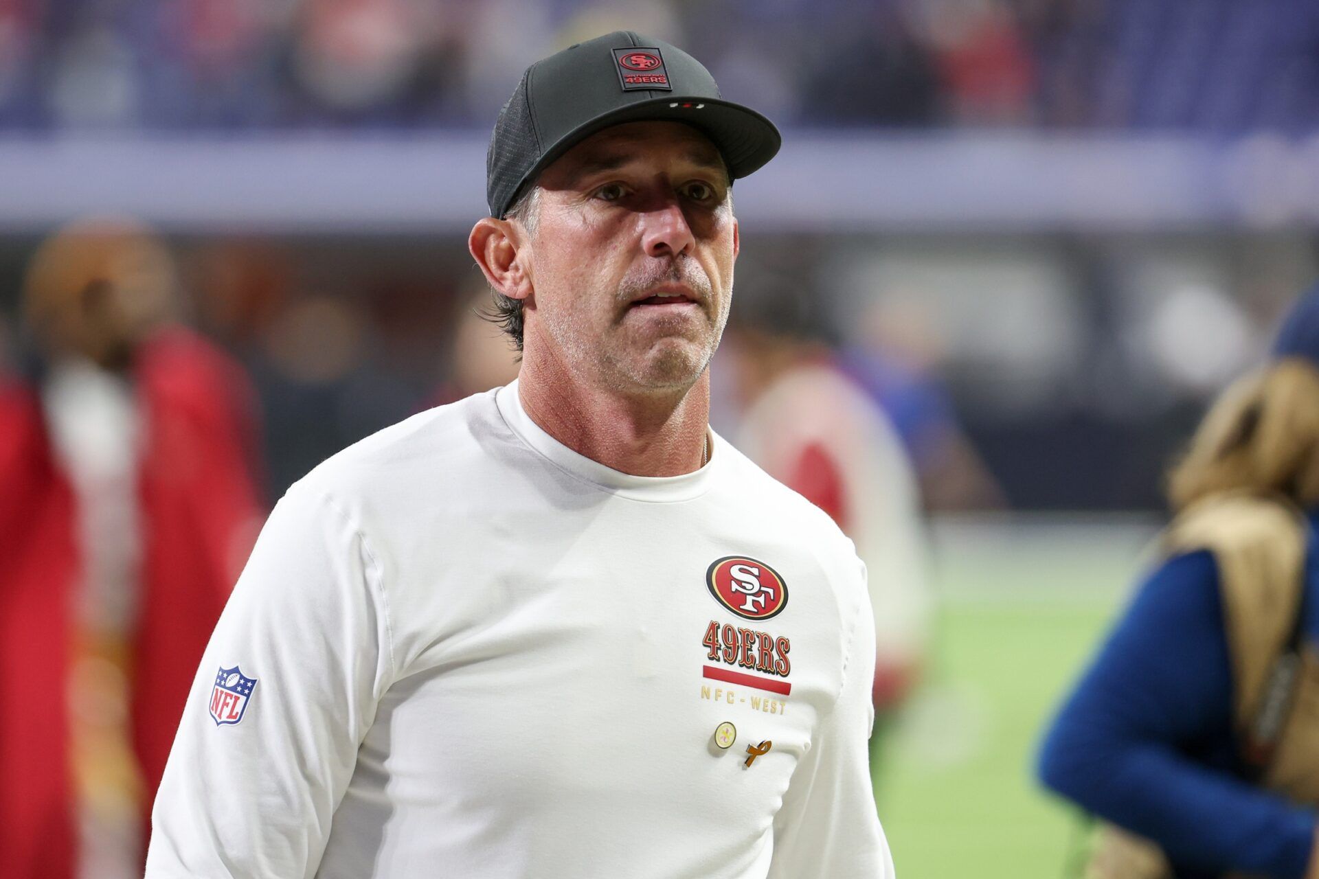 San Francisco 49ers head coach Kyle Shanahan leaves the field after the game against the Indianapolis Colts at Lucas Oil Stadium.