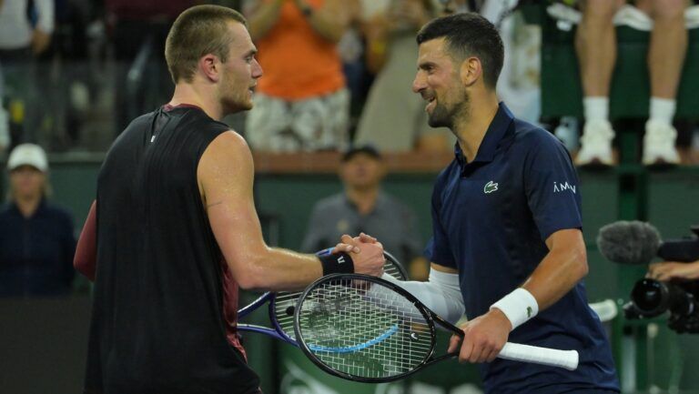 Jack Draper (GBR) shakes hands with Novak Djokovic (SRB) after winning his  his fourth round match in the BNP Paribas Open at the Indian Wells Tennis Garden.