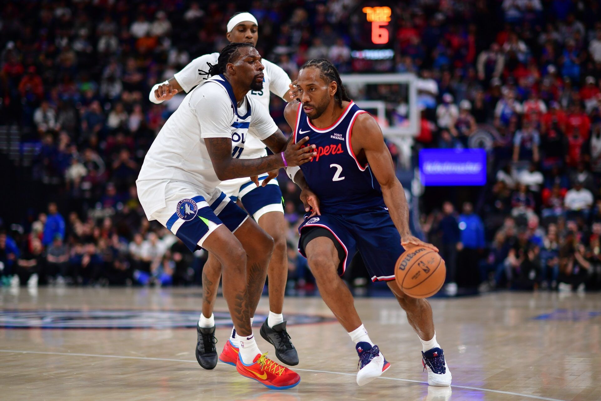 Los Angeles Clippers forward Kawhi Leonard (2) moves the ball against Minnesota Timberwolves center Naz Reid (11) during the second half at Intuit Dome.