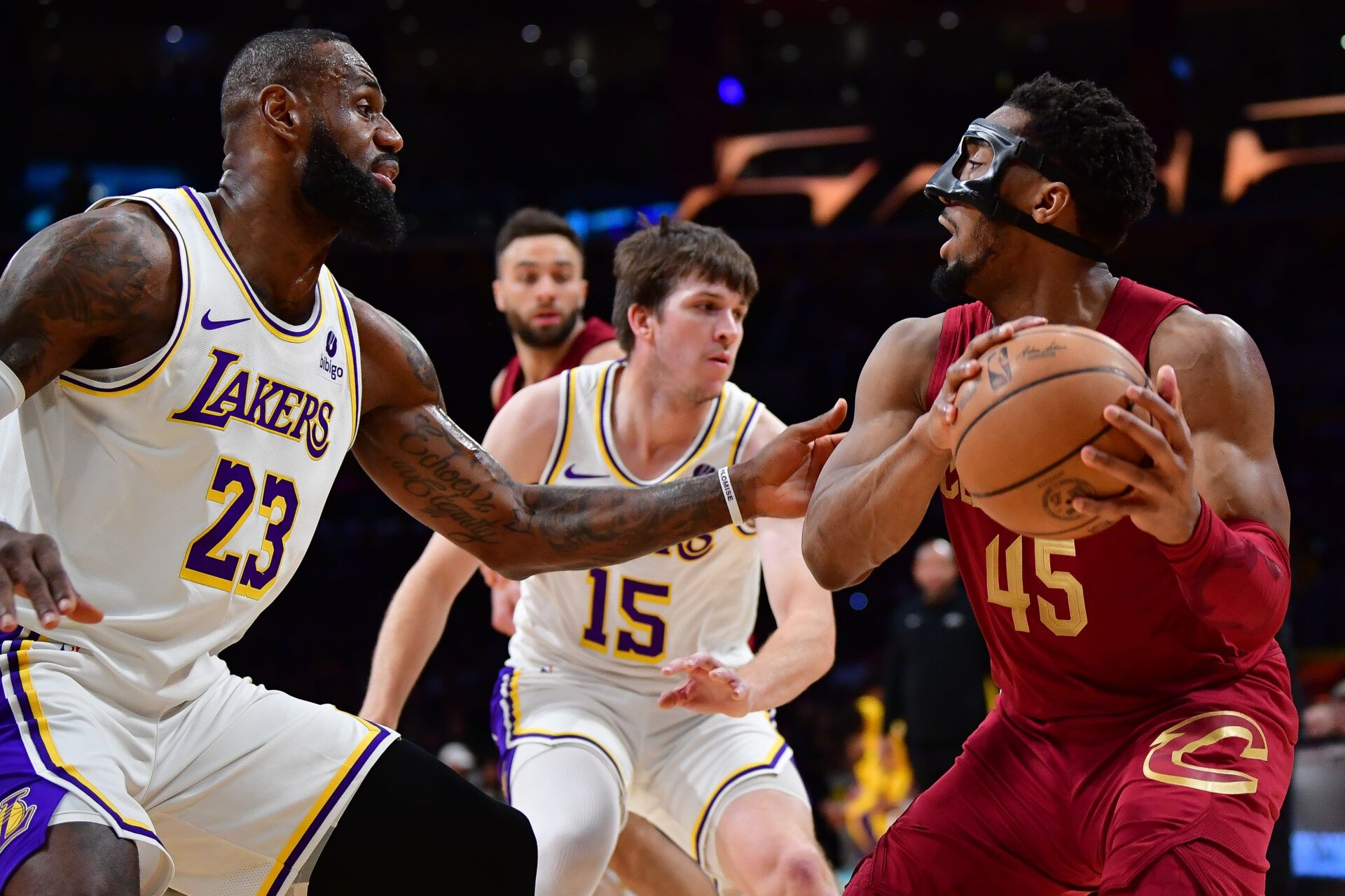 Cleveland Cavaliers guard Donovan Mitchell (45) controls the ball against Los Angeles Lakers forward LeBron James (23) during the first half at Crypto.com Arena.