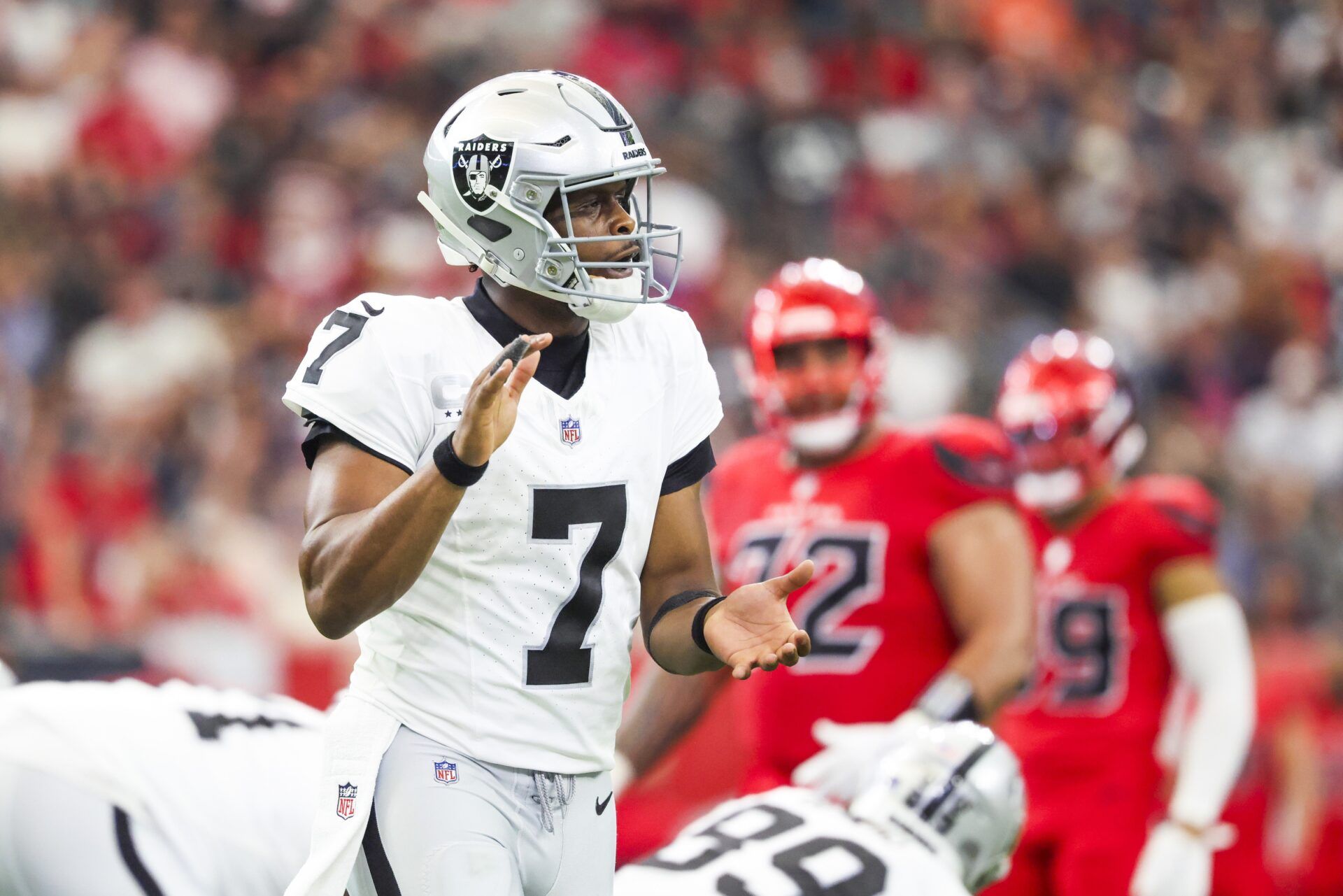 Las Vegas Raiders quarterback Geno Smith (7) reacts to a timeout against the Houston Texans during the second quarter at NRG Stadium.