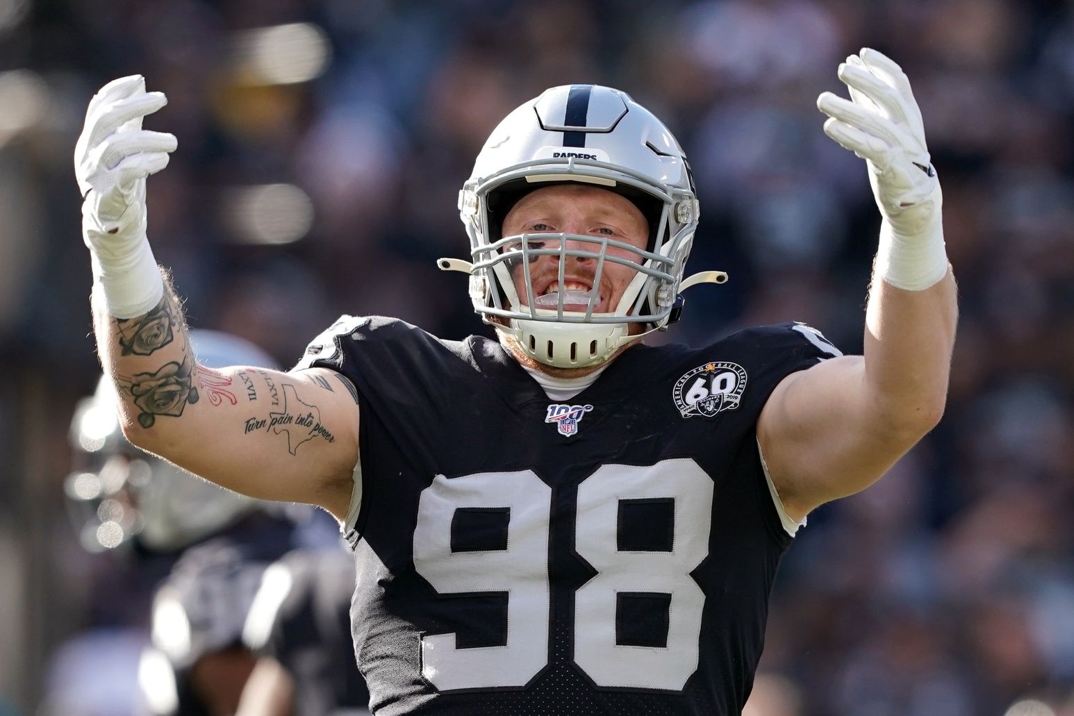 Oakland Raiders defensive end Maxx Crosby (98) gestures on the field during the first quarter against the Jacksonville Jaguars at Oakland Coliseum.