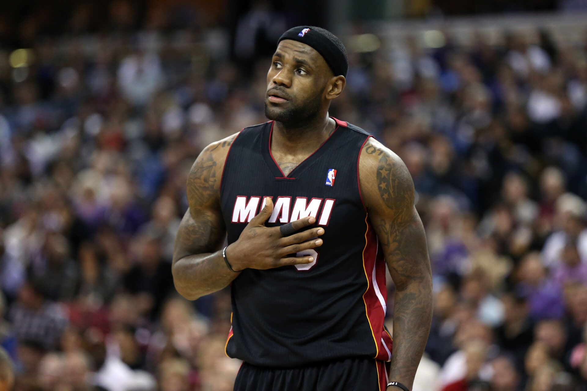 Miami Heat small forward LeBron James (6) with his hand on his chest between plays against the Sacramento Kings during the first quarter at Sleep Train Arena.