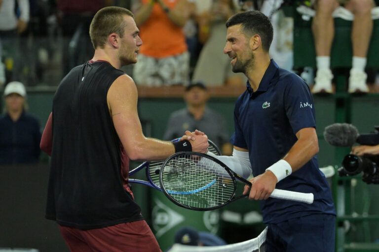 Jack Draper (GBR) shakes hands with Novak Djokovic (SRB) after winning his  his fourth round match in the BNP Paribas Open at the Indian Wells Tennis Garden.
