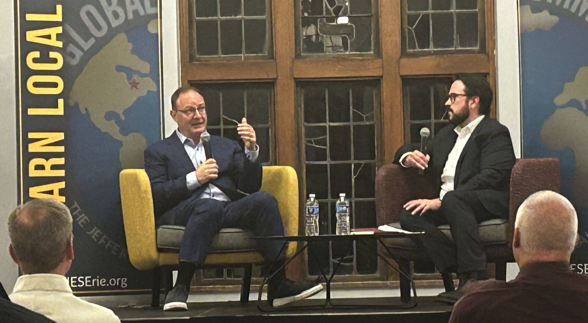 Moderator Ben Speggen (right) listens to Adrian Wojnarowski during the Oct. 27, 2025, question-and-answer session during the latter's Jefferson Education Society appearance at Gannon University's Yehl Ballroom.