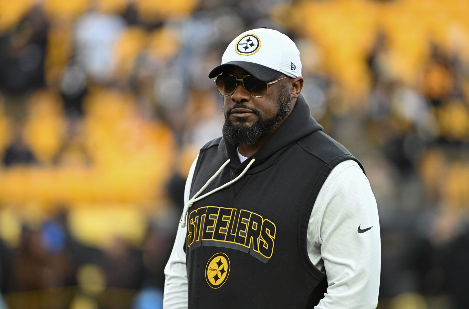 Pittsburgh Steelers head coach Mike Tomlin warms up for a game against the Buffalo Bills at Acrisure Stadium.
