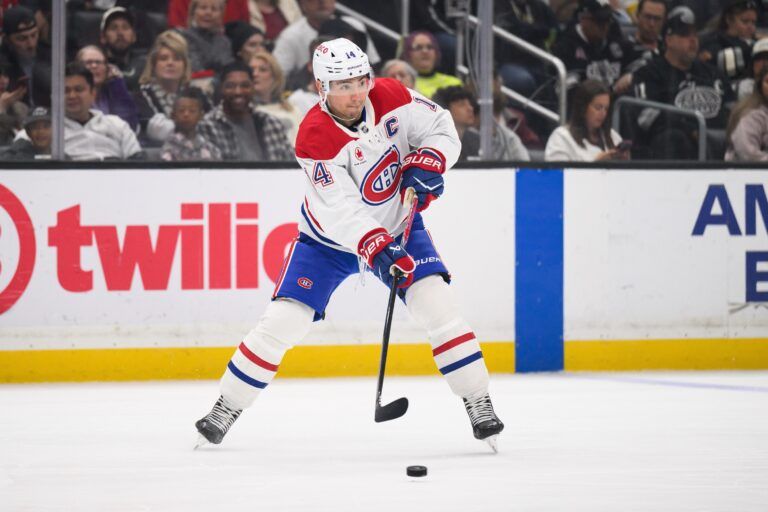 Montréal Canadiens center Nick Suzuki (14) passes the puck during the first period against the Los Angeles Kings at Crypto.com Arena.
