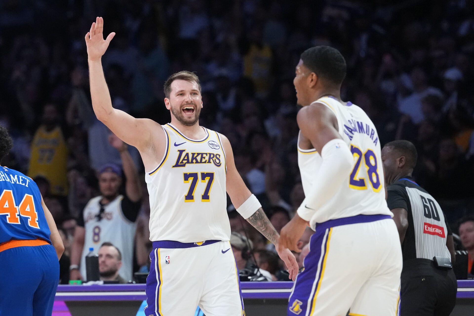 Los Angeles Lakers guard Luka Doncic (77) celebrates with forward Rui Hachimura (28) against the New York Knicks in the second half at Crypto.com Arena.