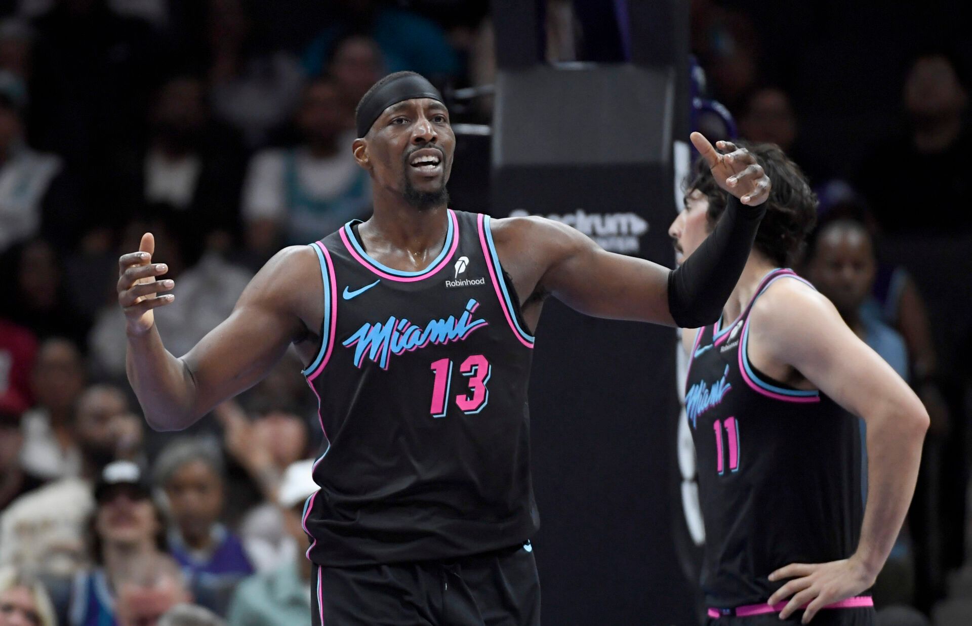 Miami Heat center Bam Adebayo (13) reacts after being called for a foul during the first half against the Charlotte Hornets at the Spectrum Center.