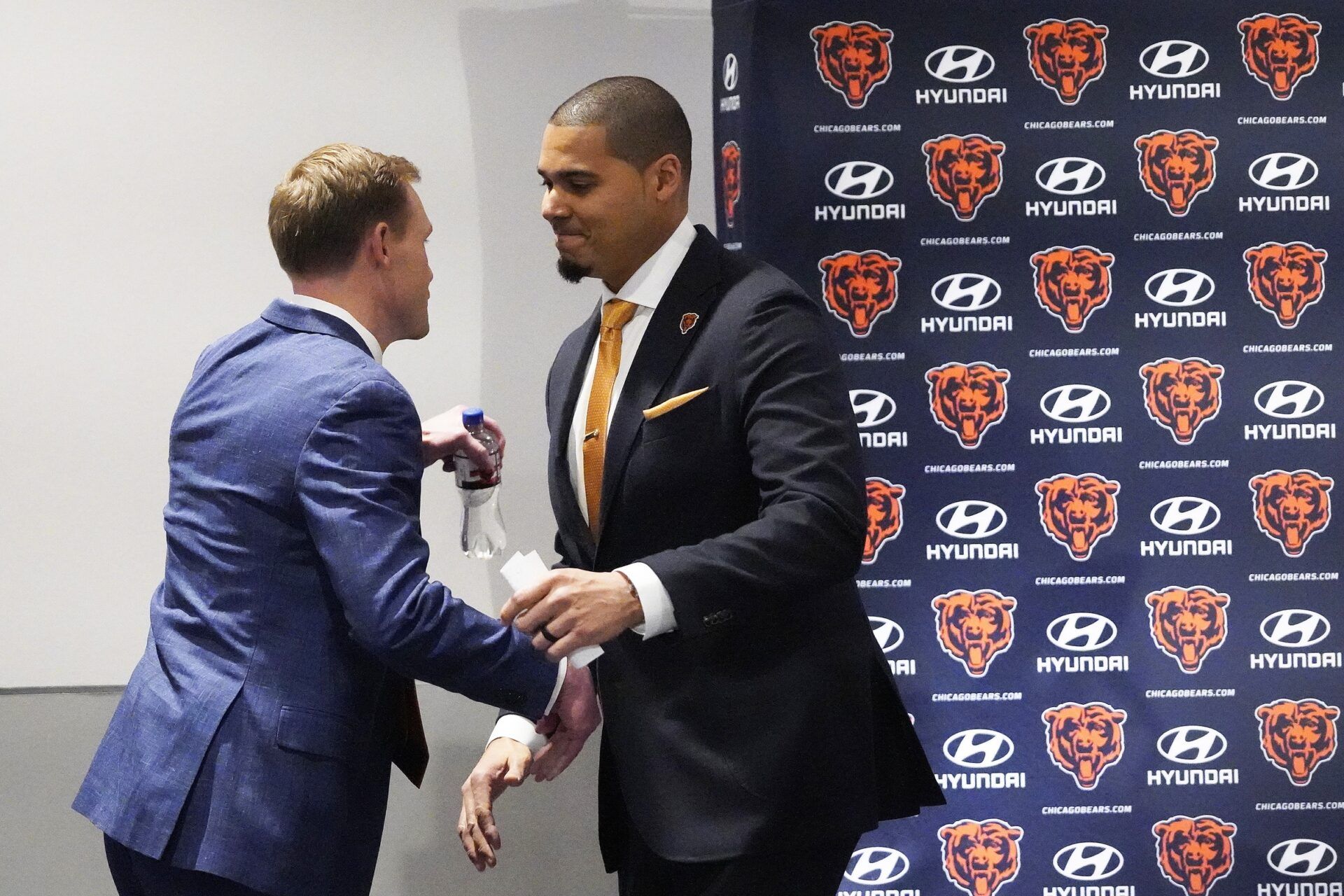 Chicago Bears new head cach Ben Johnson is greeted by general manager Ryan Poles at his introductory press conference at PNC Center.