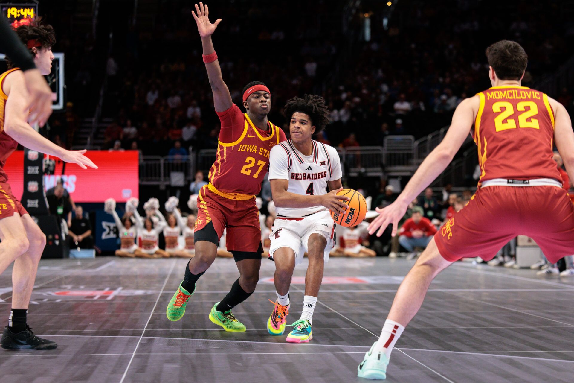 Texas Tech Red Raiders guard Christian Anderson (4) brings the ball up court around Iowa State Cyclones guard Killyan Toure (27) during the first half at T-Mobile Center.