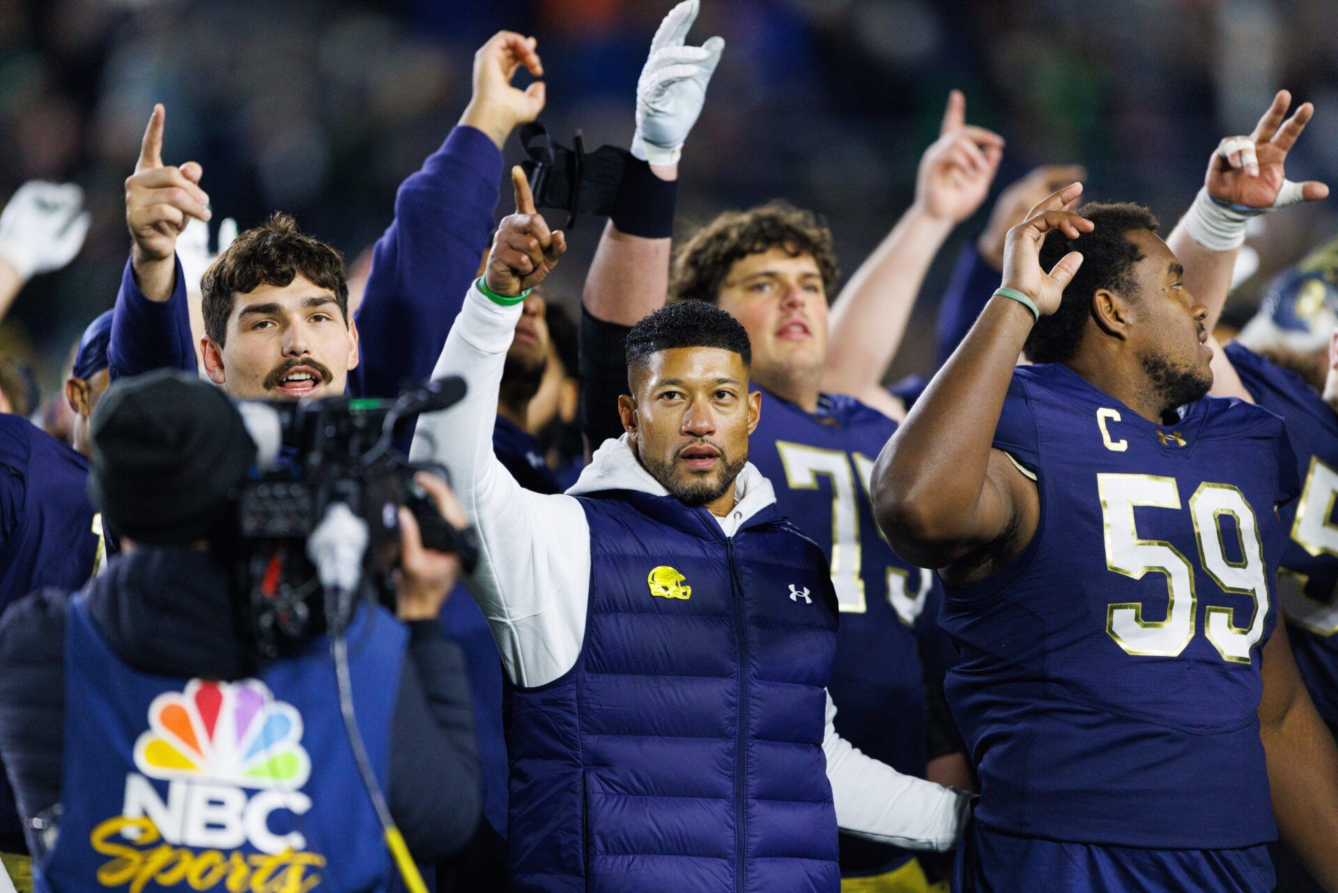 Notre Dame head coach Marcus Freeman celebrates with his players after winning a NCAA football game 70-7 against Syracuse at Notre Dame Stadium on Saturday, Nov. 22, 2025, in South Bend.