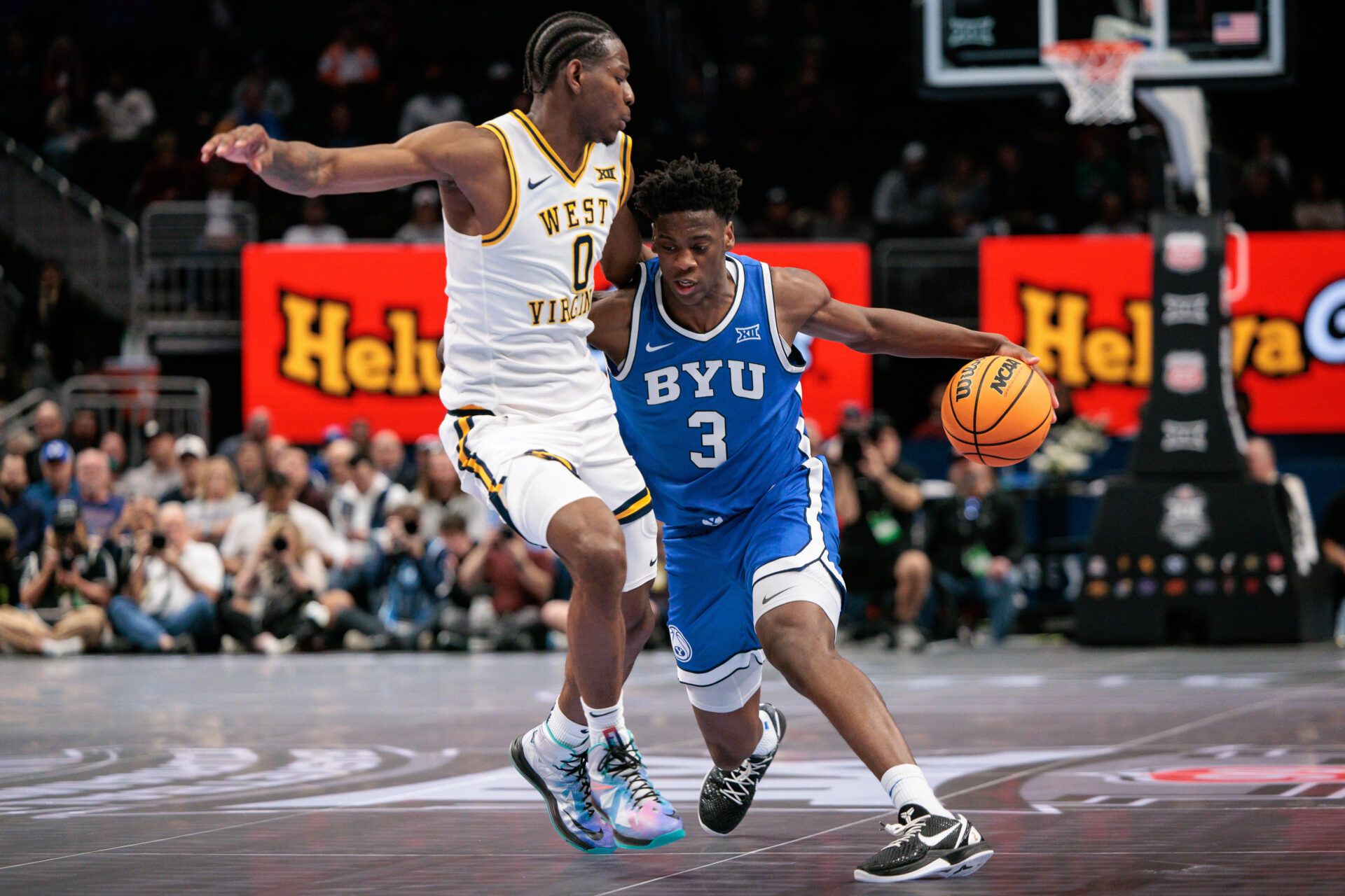 BYU Cougars forward AJ Dybantsa (3) drives around West Virginia Mountaineers forward Brenen Lorient (0) during the second half at T-Mobile Center.