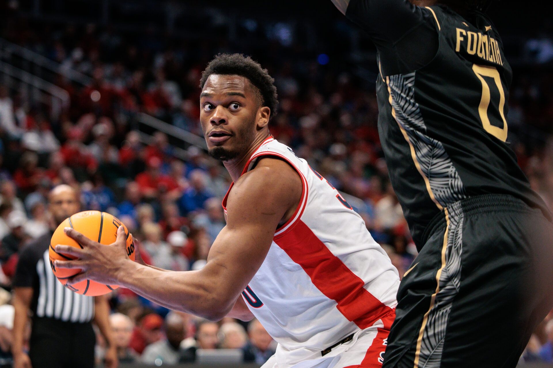 Arizona Wildcats forward Tobe Awaka (30) drives around UCF Knights center Jeremy Foumena (0) during the first half at T-Mobile Center.