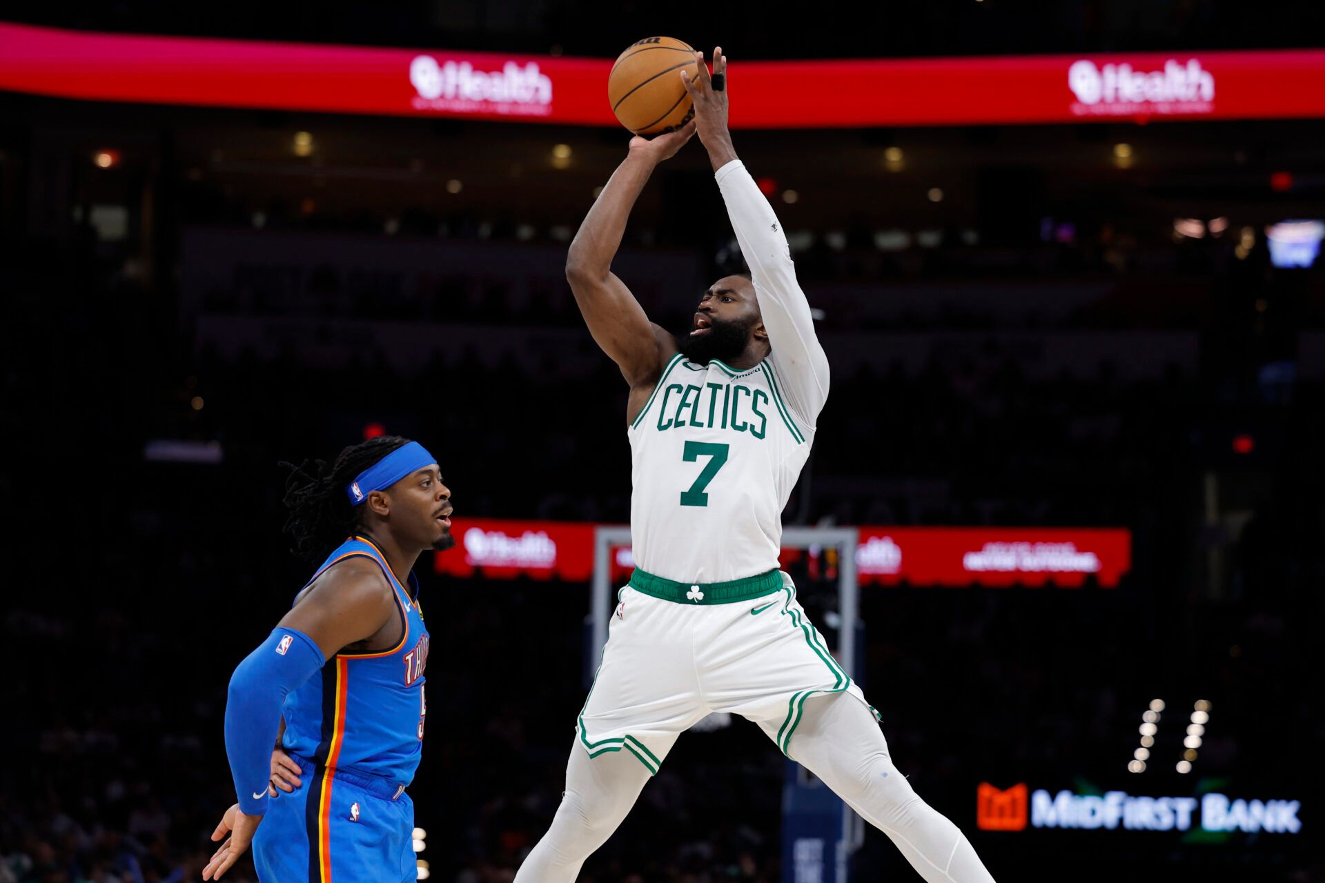 Boston Celtics guard/forward Jaylen Brown (7) shoots over Oklahoma City Thunder guard Luguentz Dort (5) during the fourth quarter at Paycom Center.