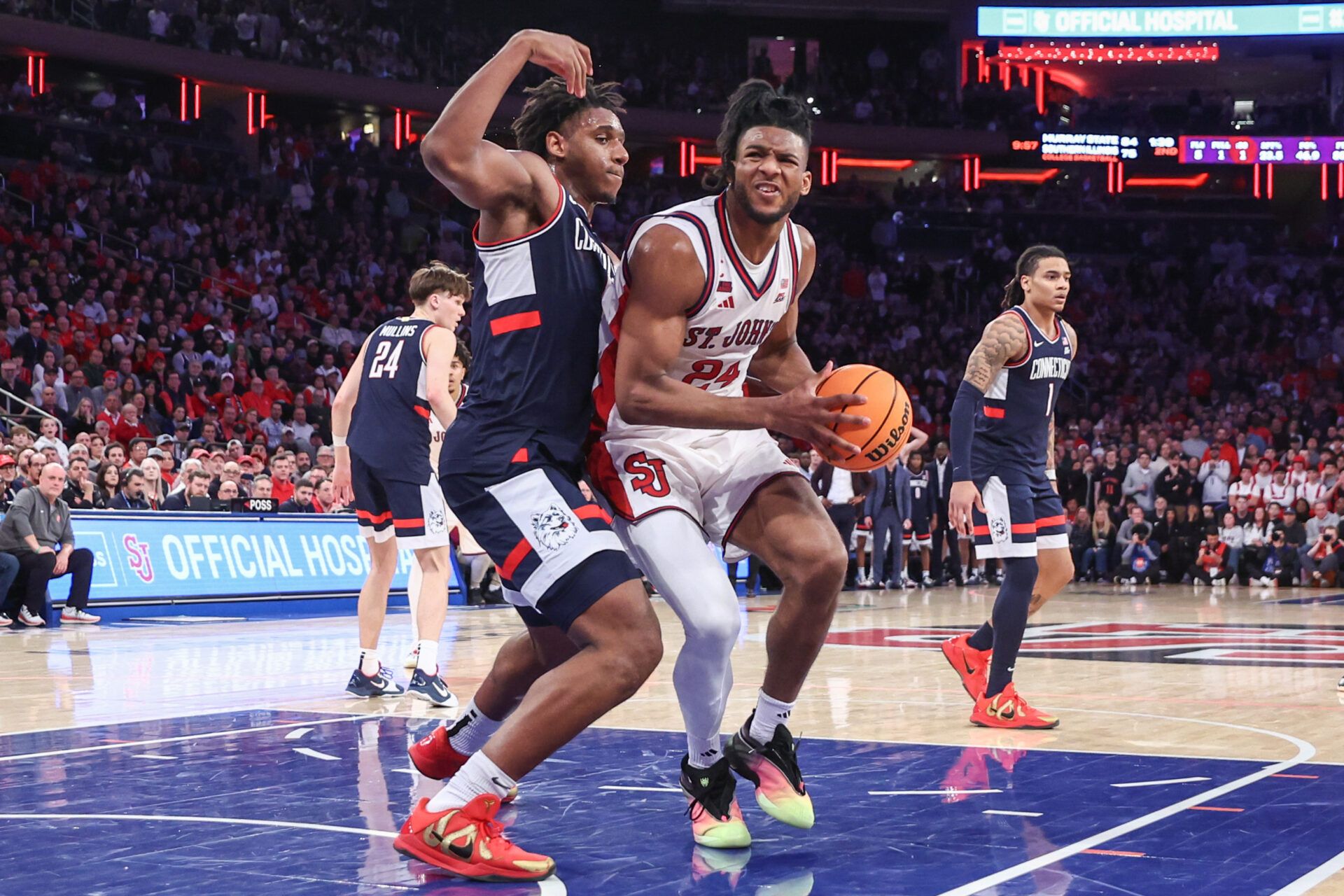 St. John's Red Storm forward Zuby Ejiofor (24) and UConn Huskies forward Tarris Reed Jr. (5) at Madison Square Garden in the Big East Tournament.
