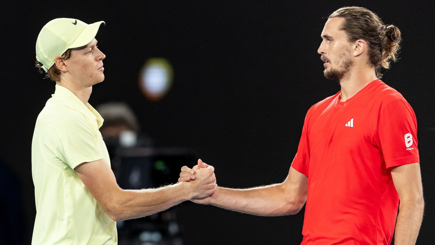 Jannik Sinner of Italy and Alexander Zverev of Germany shake hands after their match in the final of the men's singles at the 2025 Australian Open at Melbourne Park.