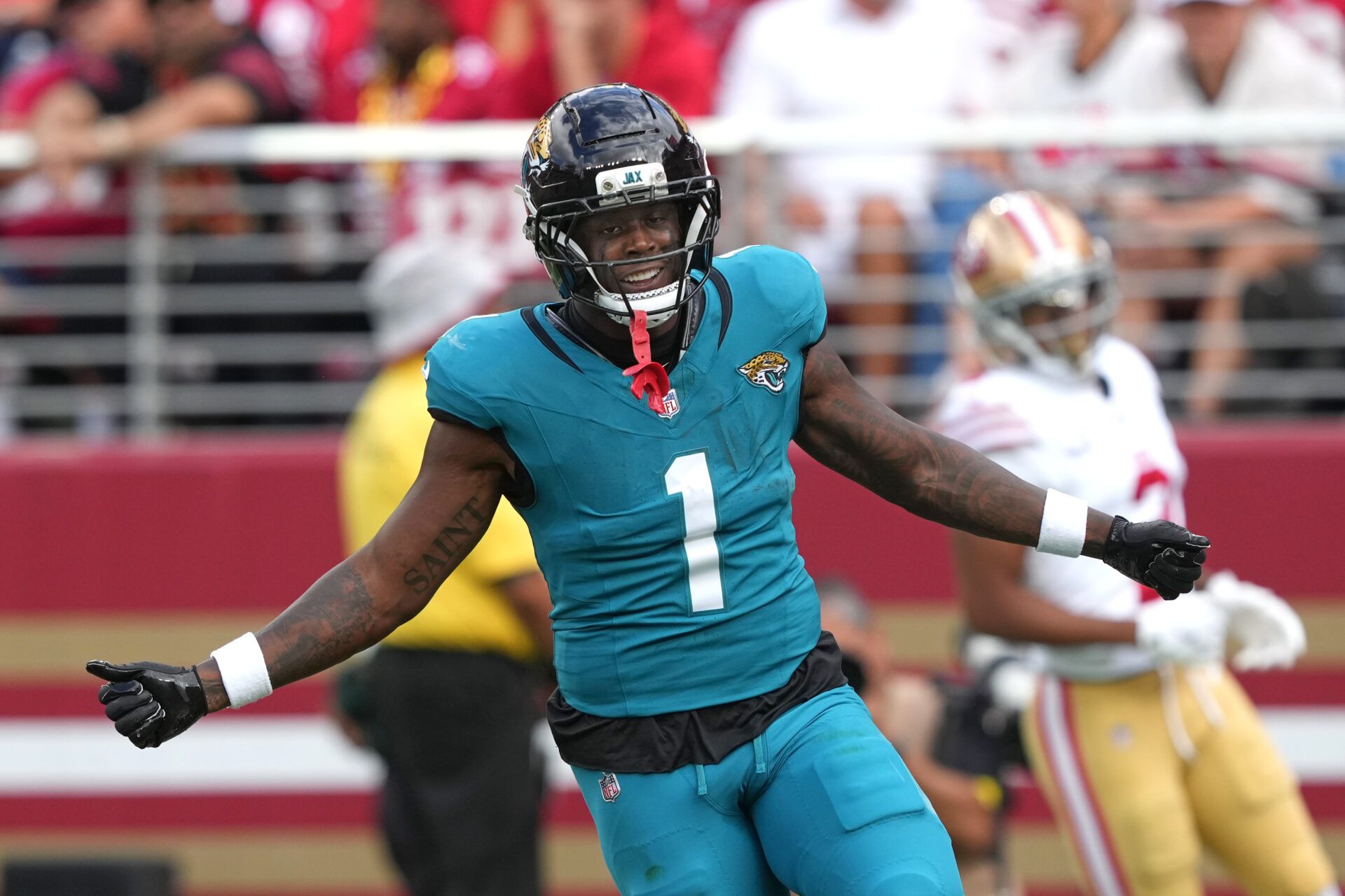 Jacksonville Jaguars running back Travis Etienne (1) reacts after scoring a touchdown against the San Francisco 49ers during the second quarter at Levi's Stadium.