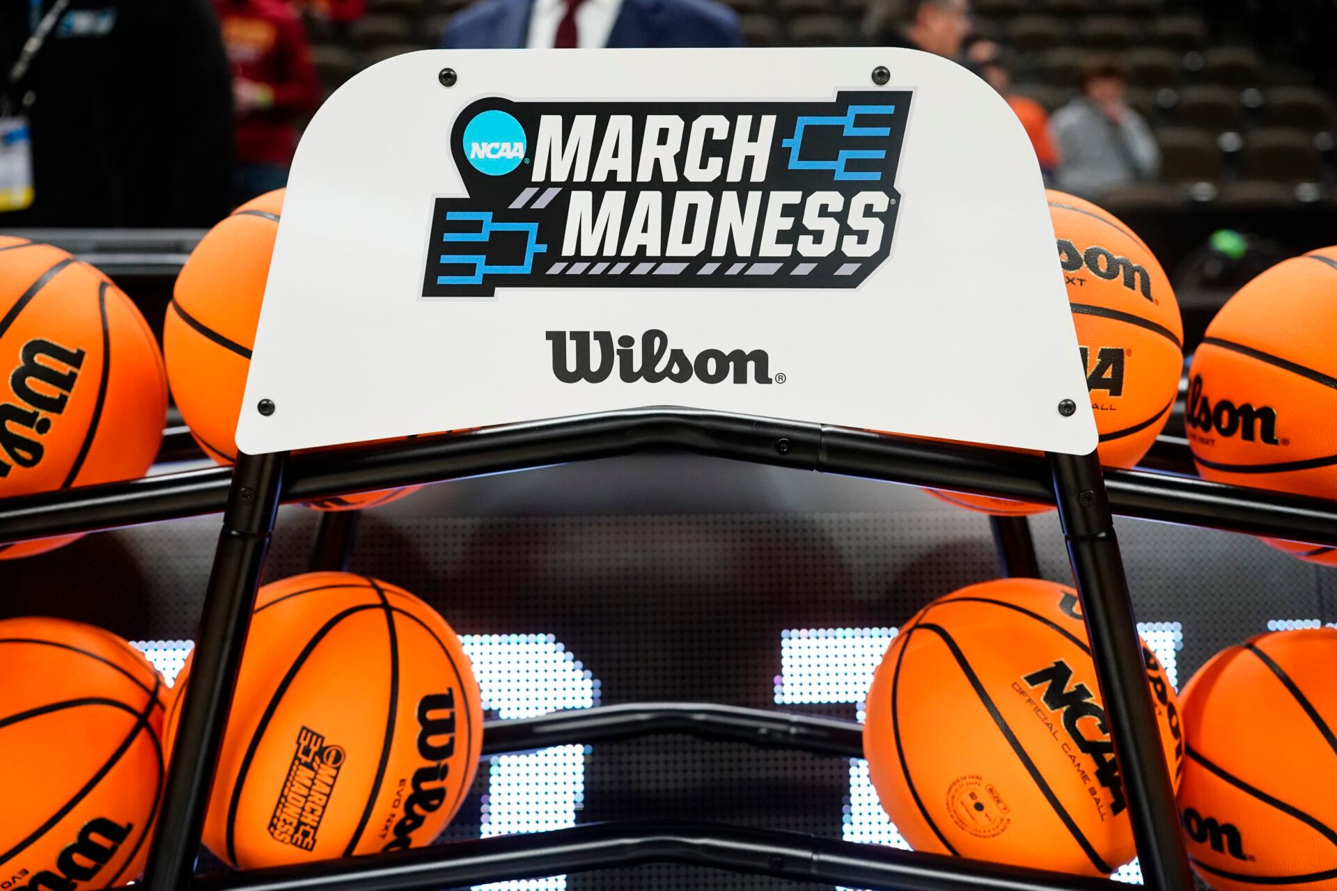 A general view of the NCAA March Madness basketballs, chair, and logo prior to the second round game between the Washington State Cougars and the Iowa State Cyclones in the 2024 NCAA Men’s Tournament at CHI Health Center Omaha.