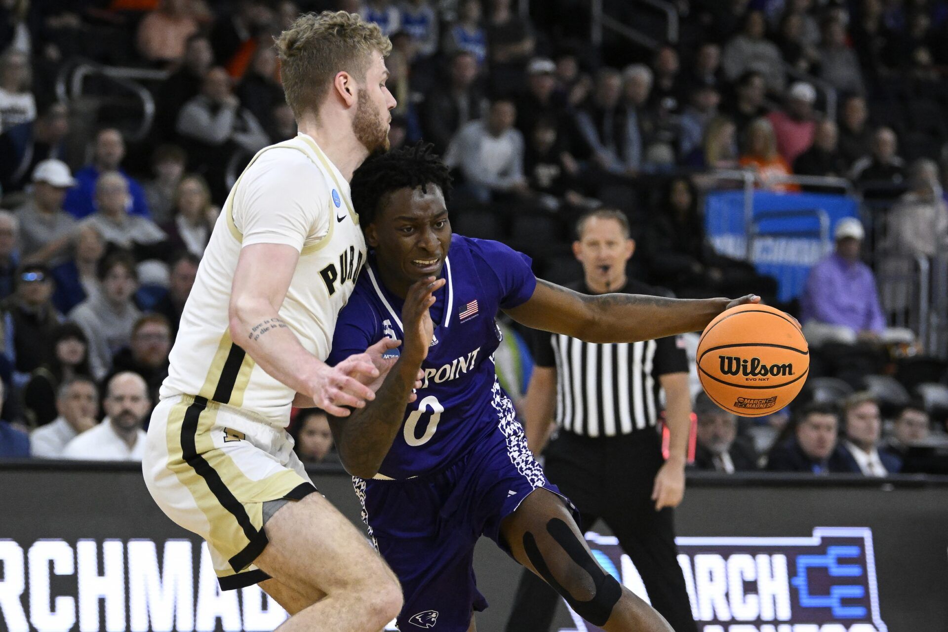 High Point Panthers forward Terry Anderson (0) drives against Purdue Boilermakers forward Caleb Furst (1) during the first half at Amica Mutual Pavilion.