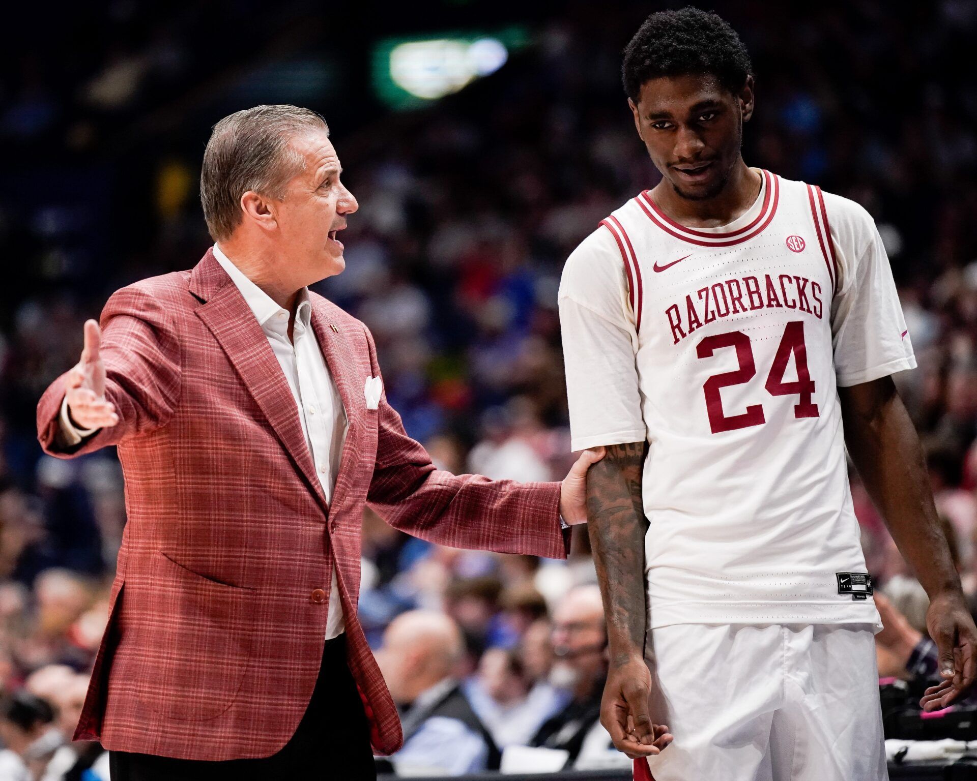 Arkansas coach John Calipari works with forward Billy Richmond III (24) during the first half of a SEC tournament semifinal game against Mississippi at Bridgestone Arena in Nashville, Tenn., Saturday, March 14, 2026. © ANDREW NELLES / THE TENNESSEAN / USA TODAY NETWORK via Imagn Images