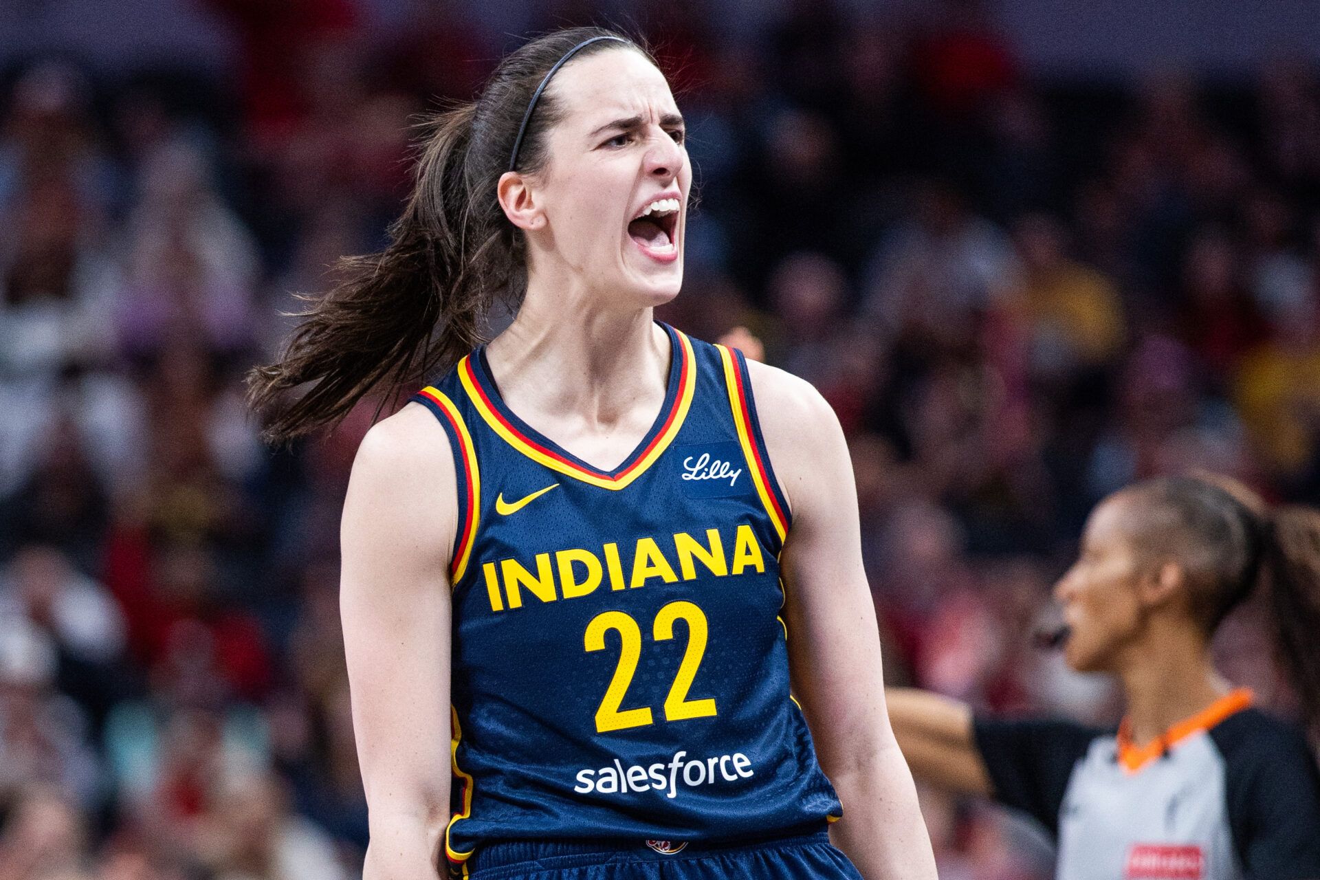 Indiana Fever guard Caitlin Clark (22) celebrates a made basket in the first half against the New York Liberty at Gainbridge Fieldhouse.