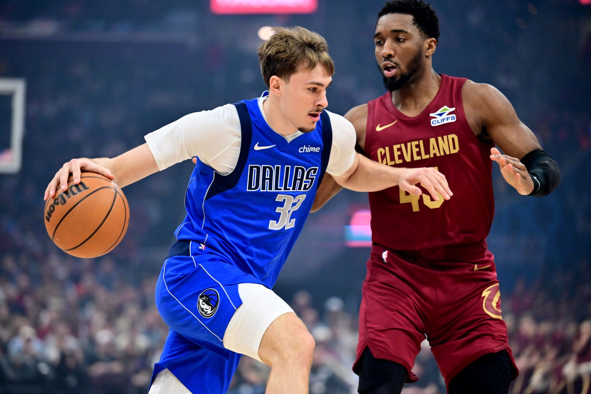 Dallas Mavericks forward Cooper Flagg (32) drives to the basket against Cleveland Cavaliers guard Donovan Mitchell (45) during the first quarter at Rocket Arena.