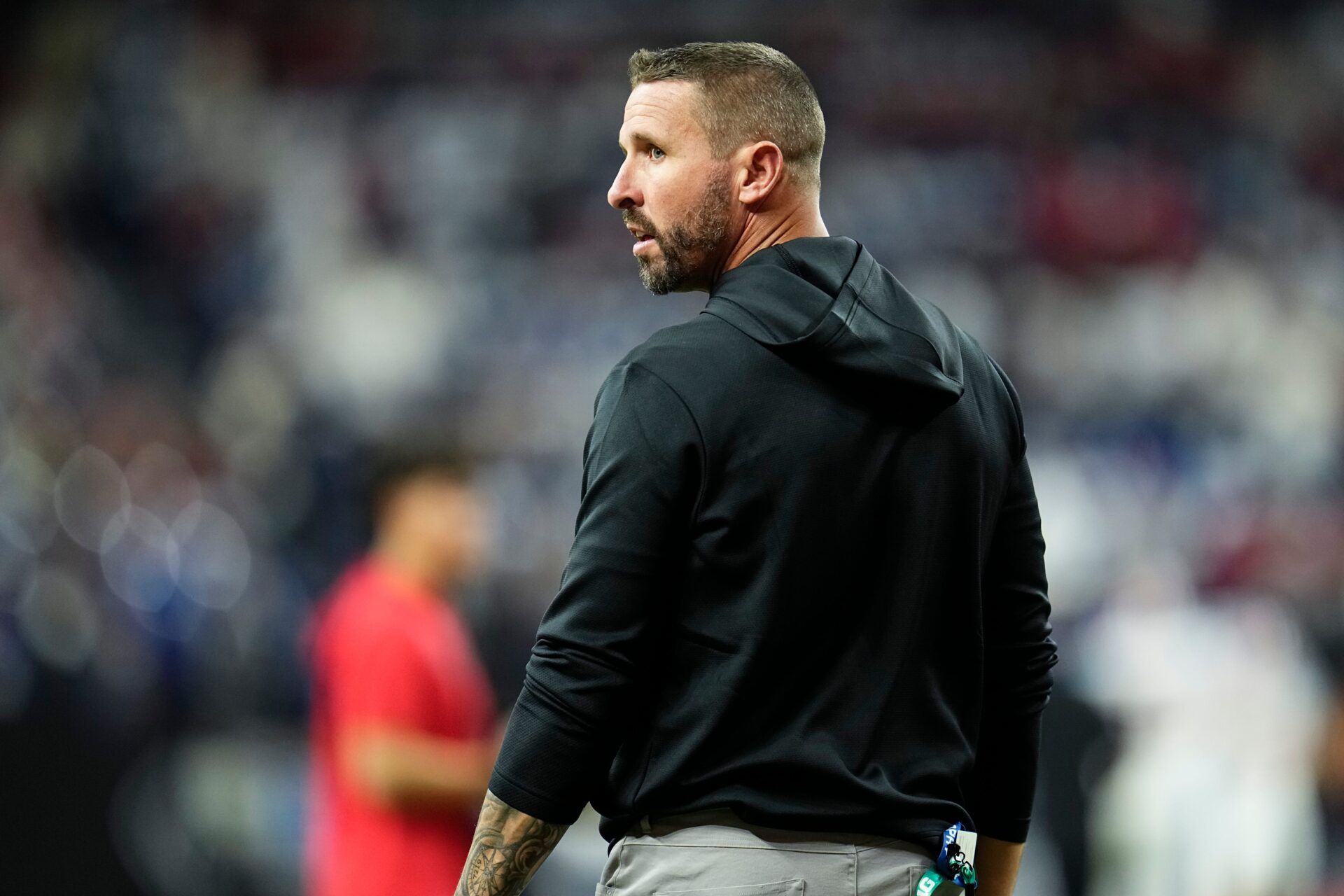 Ohio State Buckeyes offensive coordinator Brian Hartline takes the field for warm ups prior to the Big Ten Conference championship game against the Indiana Hoosiers at Lucas Oil Stadium in Indianapolis on Dec. 6, 2025. Ohio State lost 13-10.