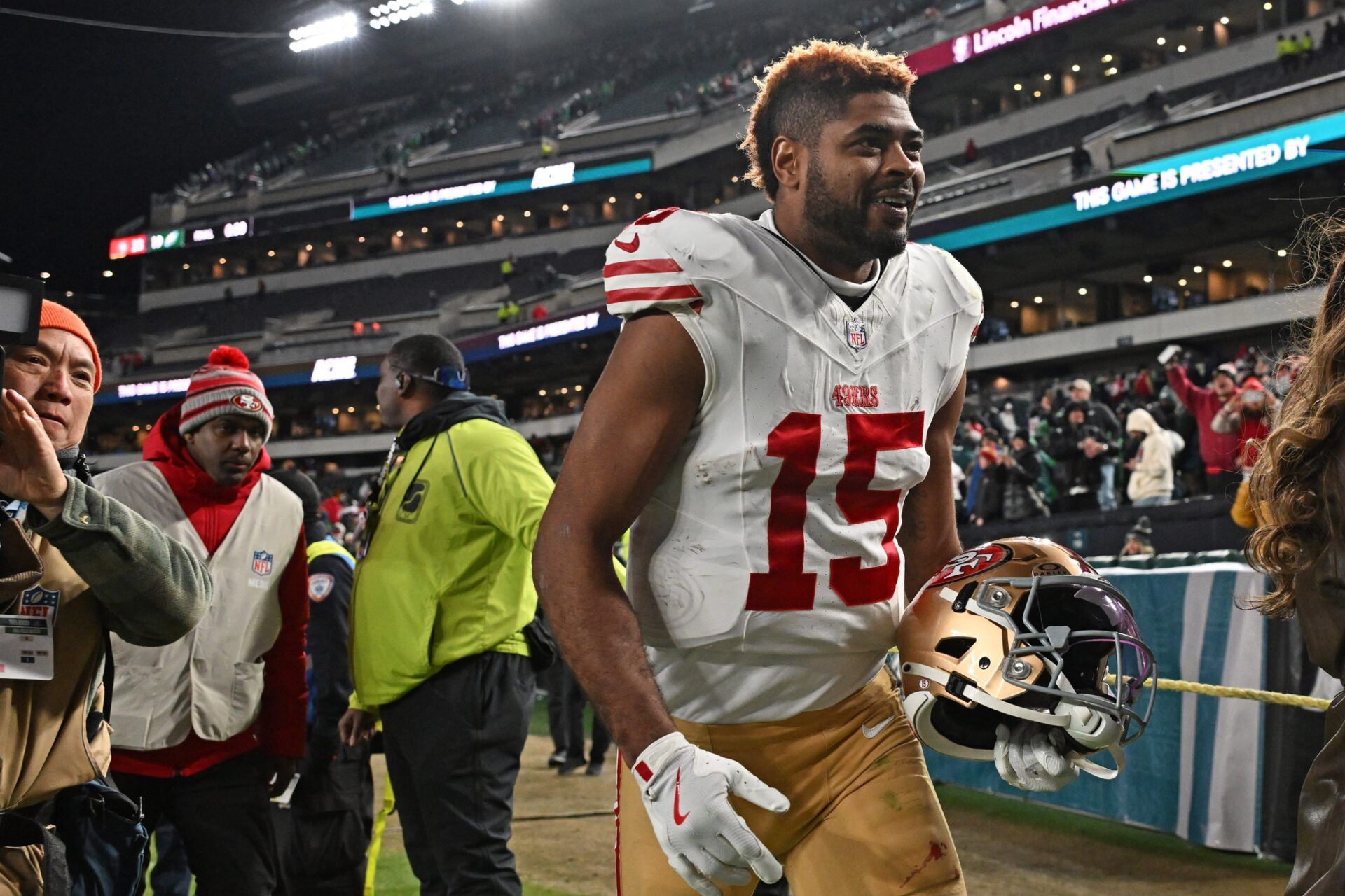San Francisco 49ers wide receiver Jauan Jennings (15) walks off the field after win against the Philadelphia Eagles in an NFC Wild Card Round game at Lincoln Financial Field.