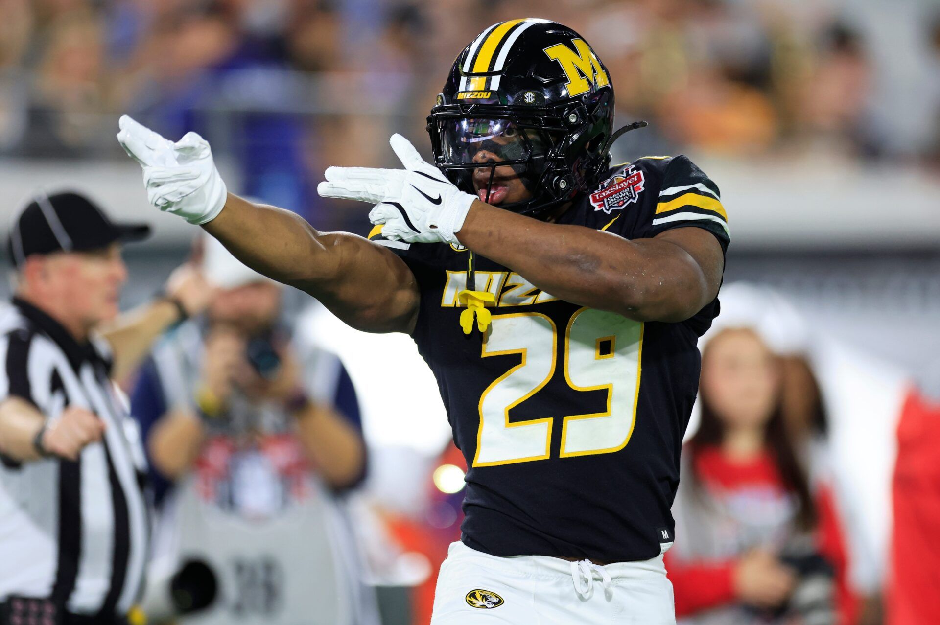 Missouri Tigers running back Ahmad Hardy (29) reacts to his first down pickup during the first quarter of the TaxSlayer Gator Bowl at EverBank Stadium, Saturday, Dec. 27, 2025, in Jacksonville. Fla. [Corey Perrine/Florida Times-Union]