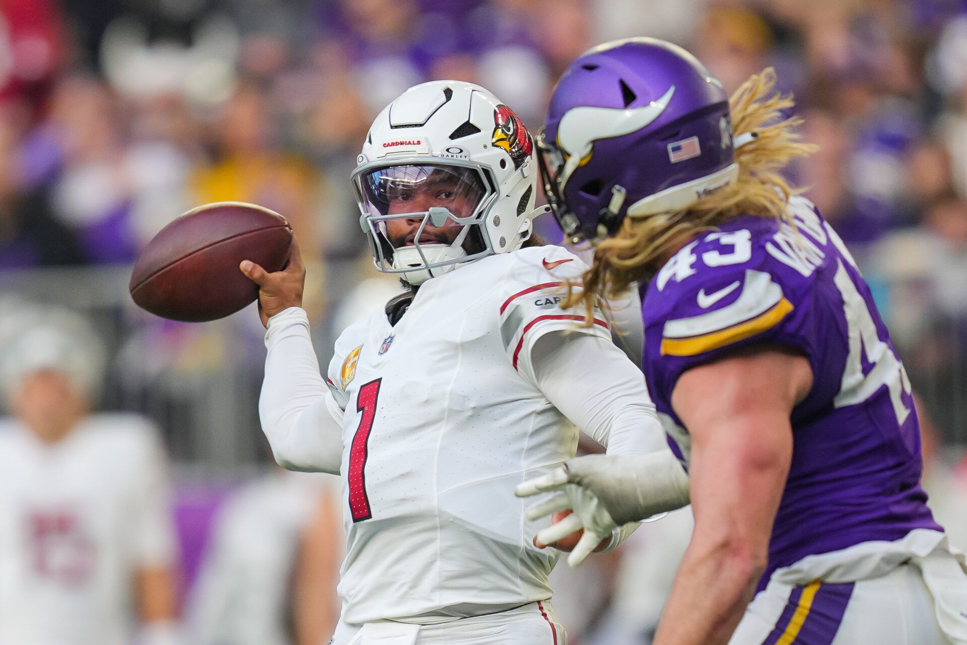 Arizona Cardinals quarterback Kyler Murray (1) passes against the Minnesota Vikings linebacker Andrew Van Ginkel (43) in the fourth quarter at U.S. Bank Stadium.
