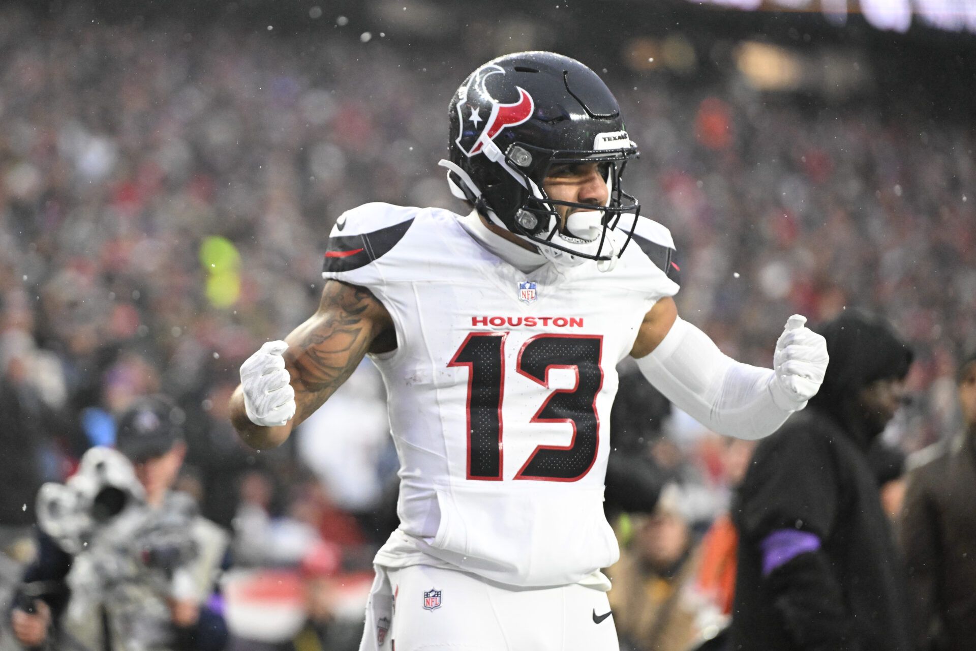 Houston Texans wide receiver Christian Kirk (13) celebrates a touchdown in the second quarter against the New England Patriots in an AFC Divisional Round game at Gillette Stadium.