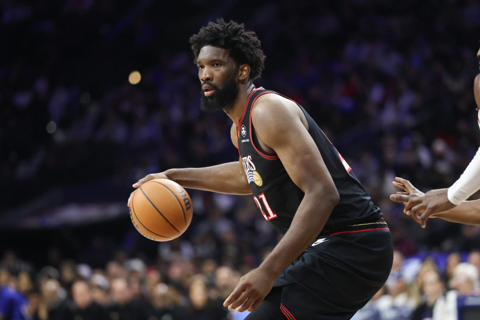 Philadelphia 76ers center Joel Embiid (21) controls the ball against the Miami Heat during the third quarter at Xfinity Mobile Arena.